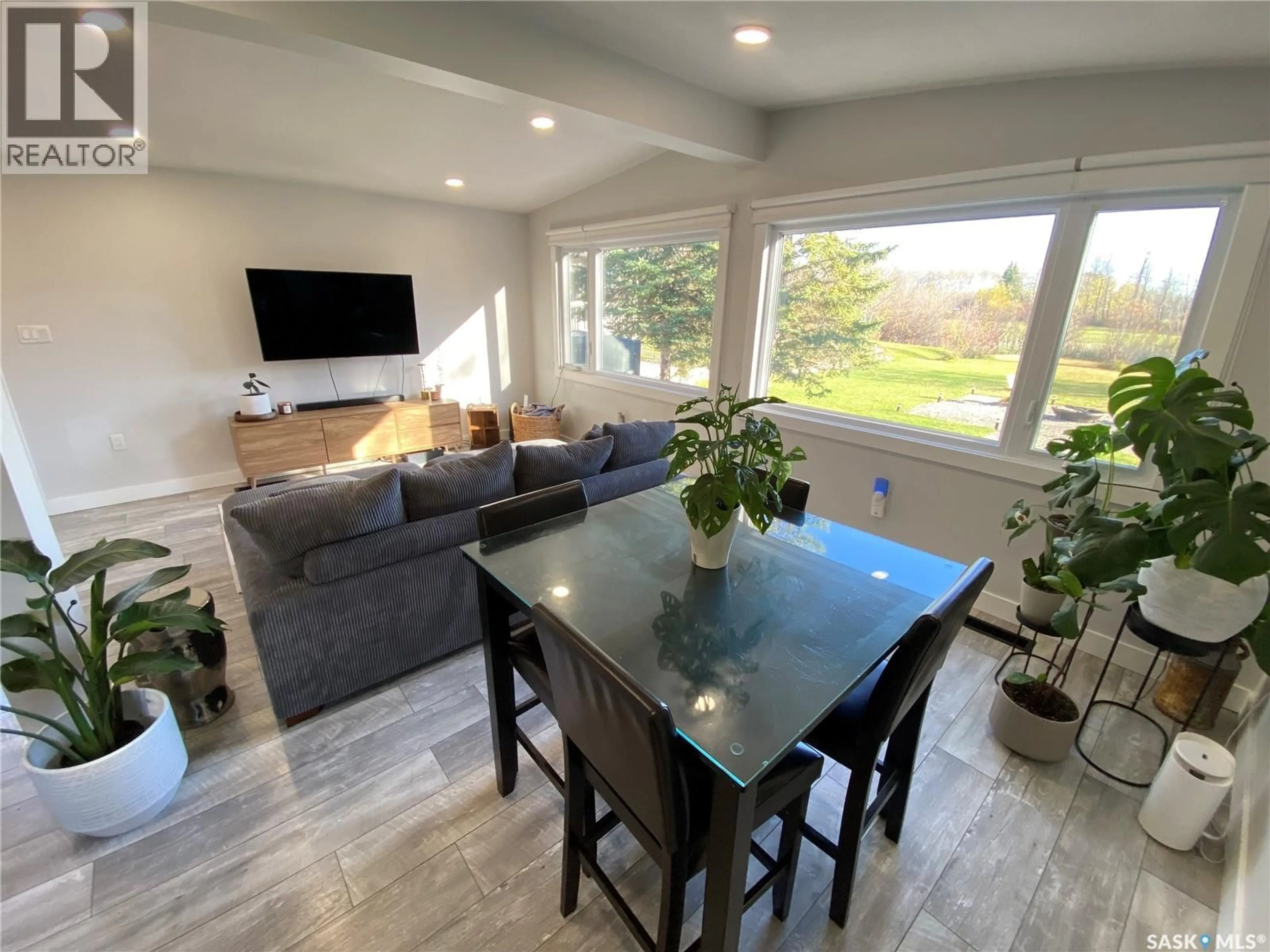 Living room with furniture, wood/laminate floor for 408 CAPALANO DRIVE, Good Spirit Lake Saskatchewan S0A0L1