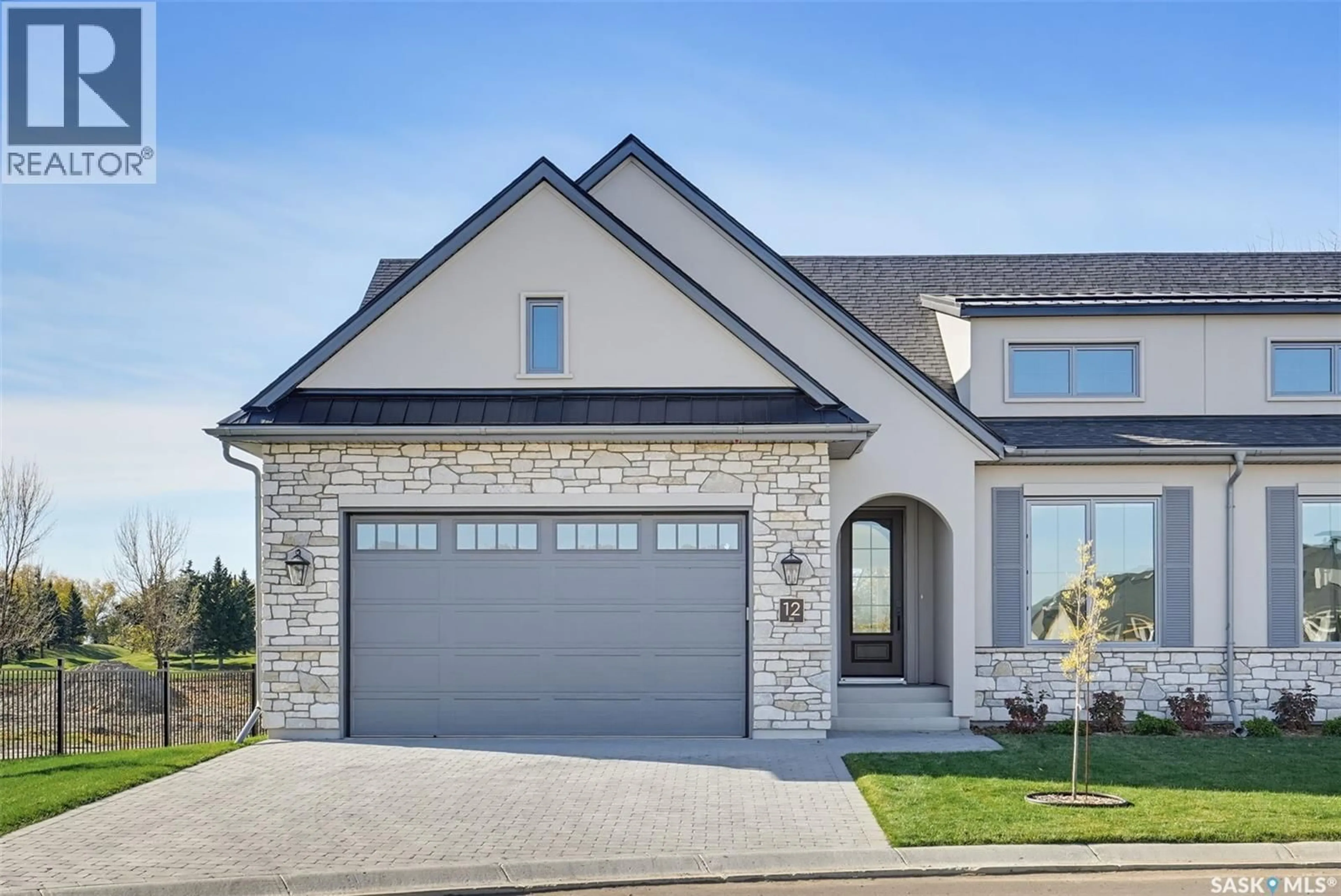 Home with brick exterior material, street for 12 350 CARTWRIGHT STREET, Saskatoon Saskatchewan S7T1B1