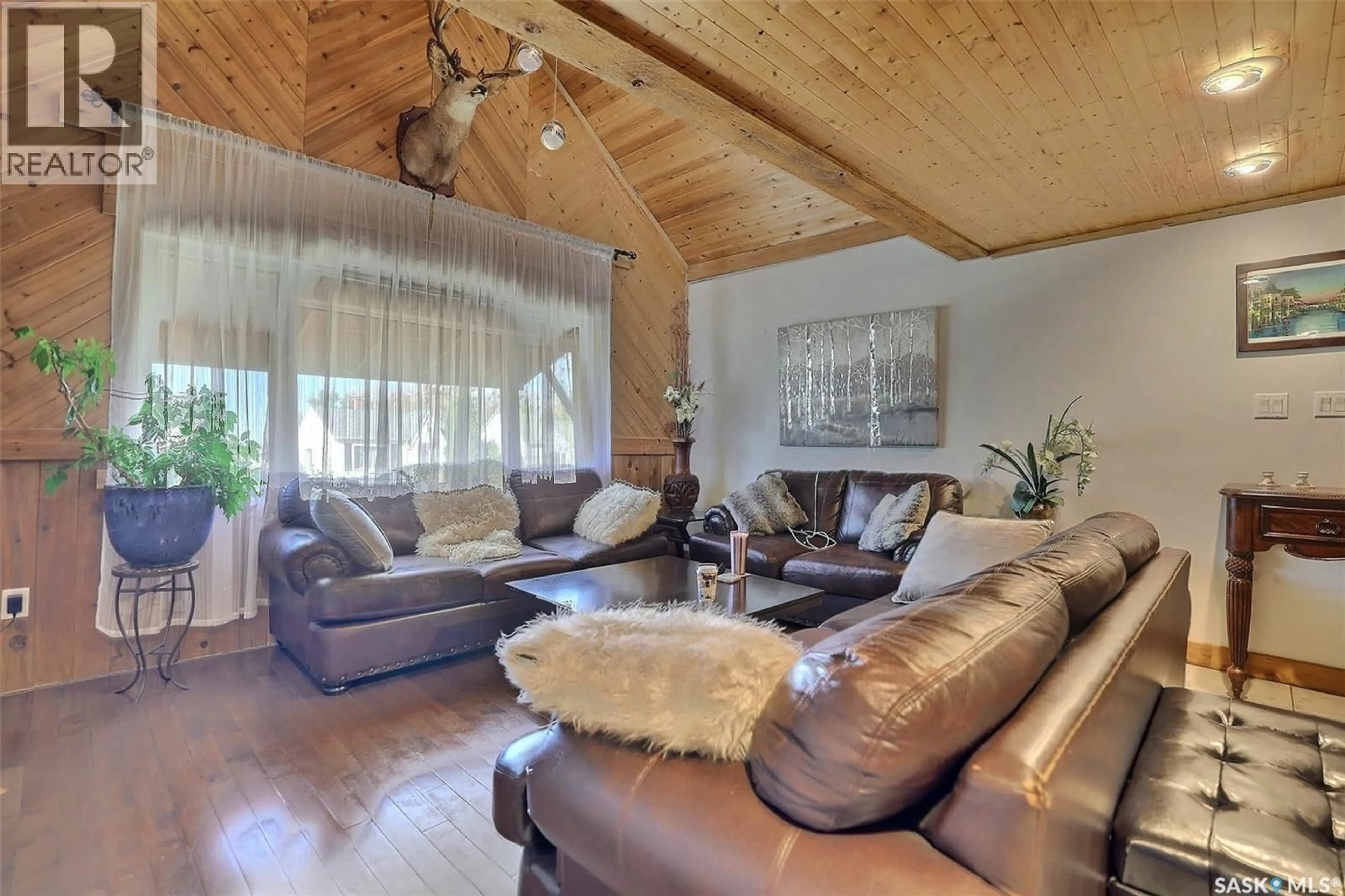 Living room with furniture, wood/laminate floor for 2335 REYNOLDS STREET, Regina Saskatchewan S4N3N6