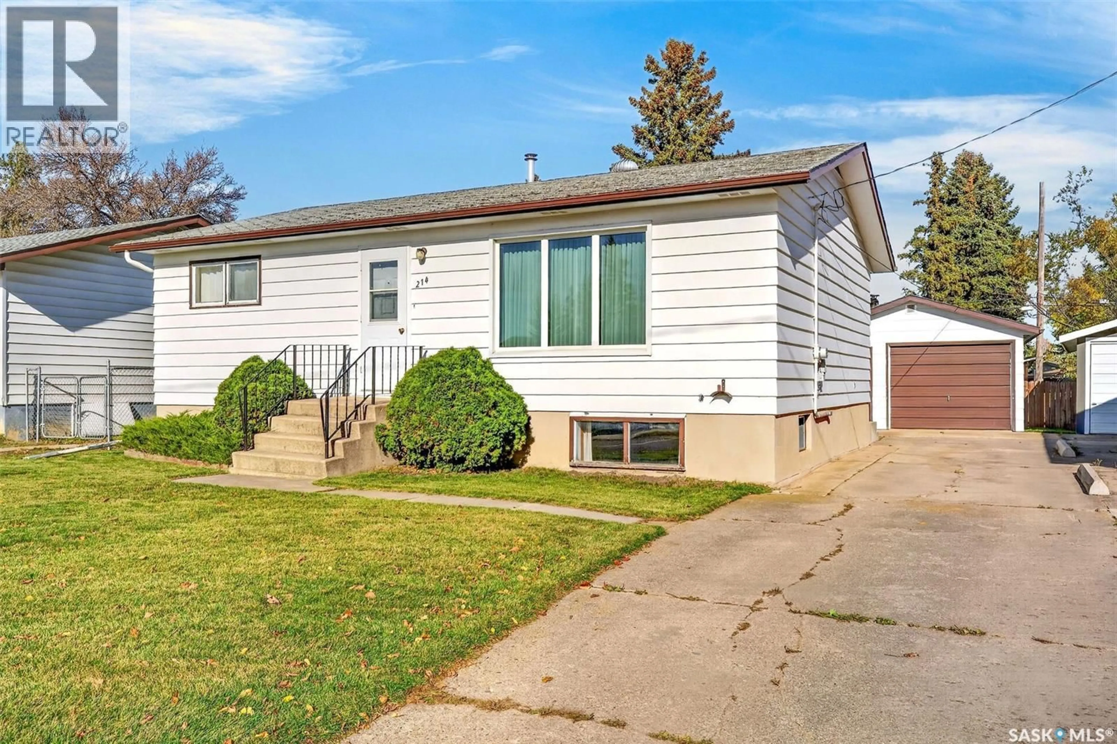 Home with vinyl exterior material, street for 214 BURNS AVENUE, Melfort Saskatchewan S0E1A0