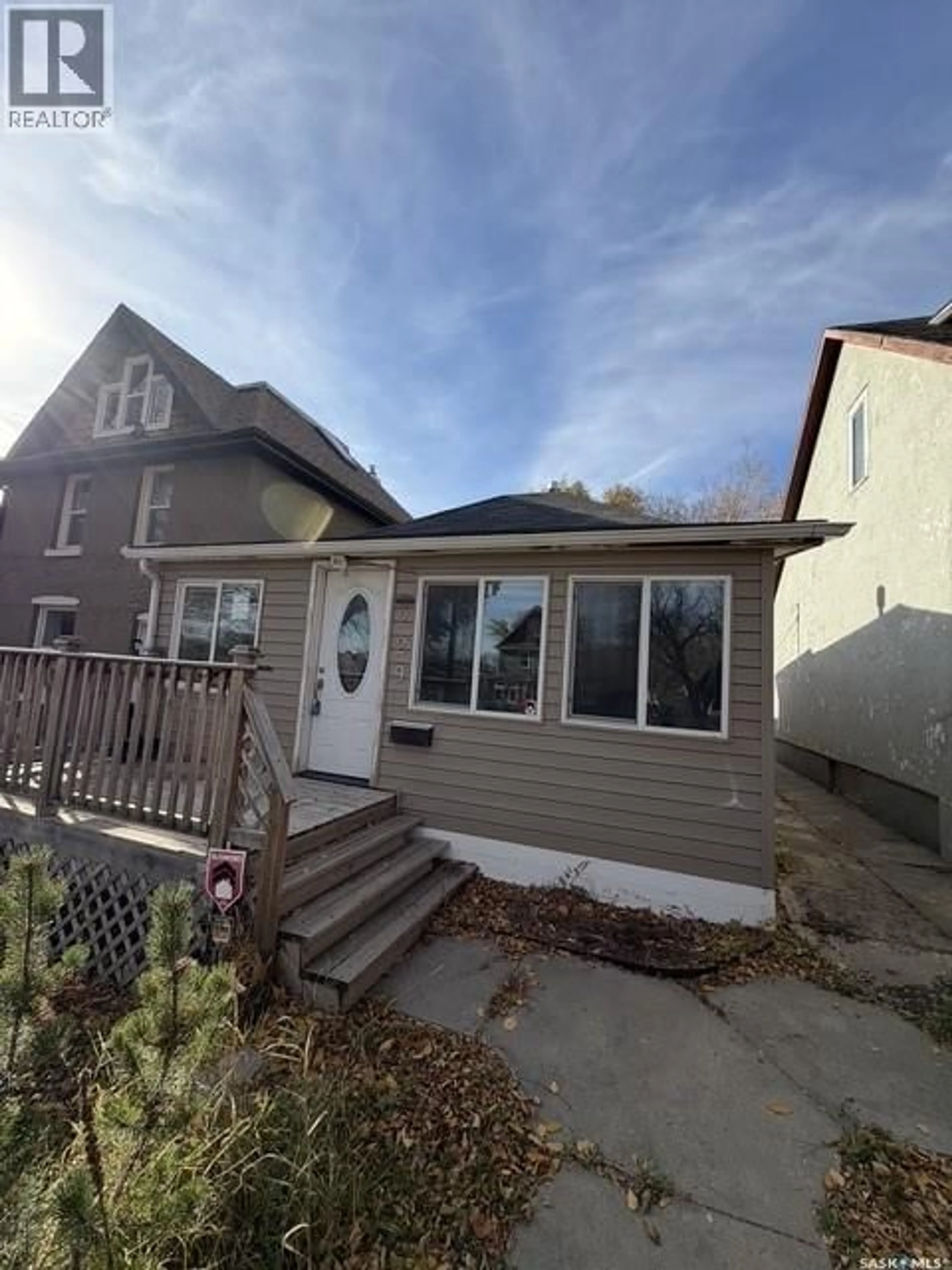 Home with vinyl exterior material, street for 229 I AVENUE, Saskatoon Saskatchewan S7L2G3
