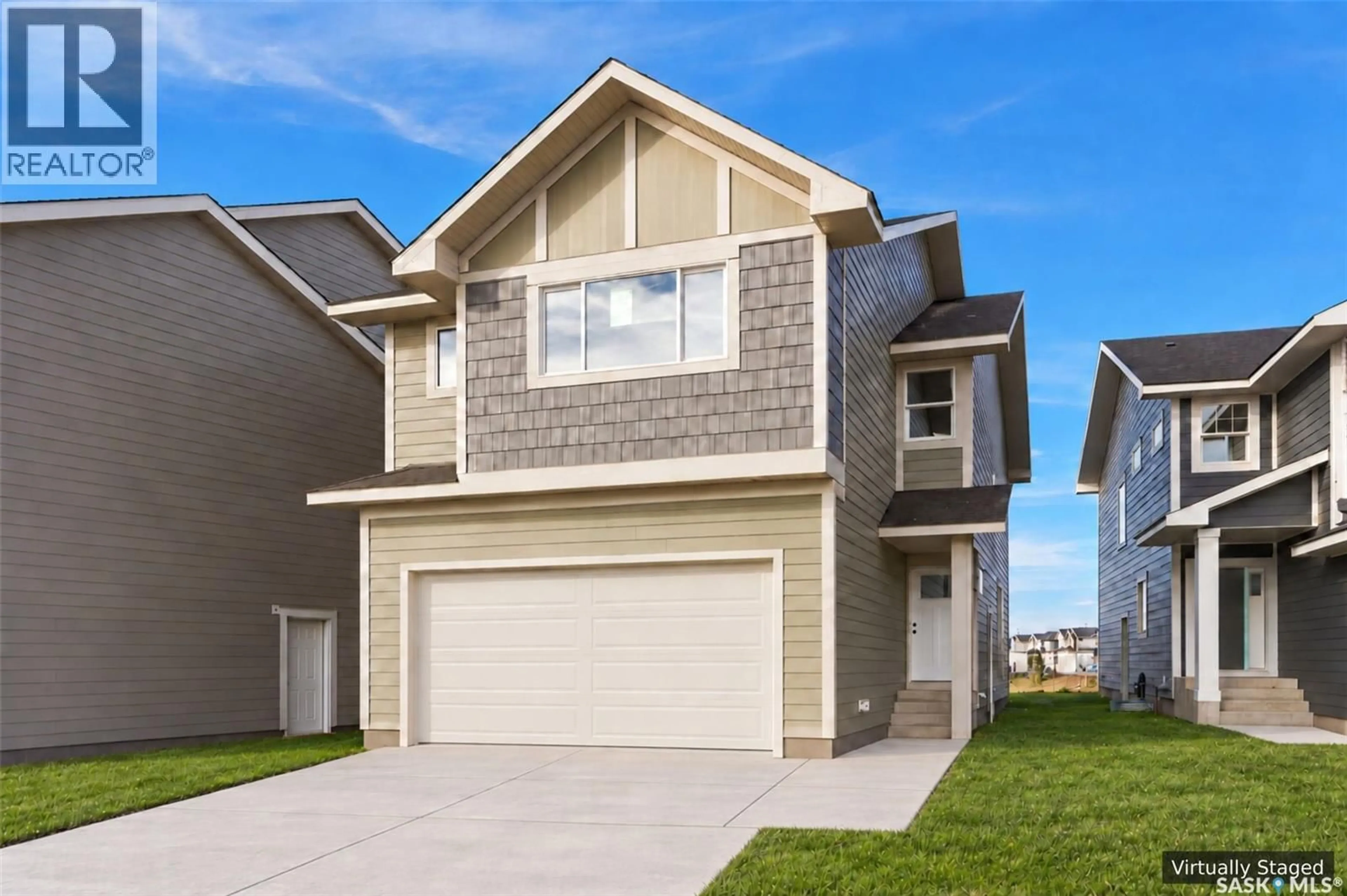Home with vinyl exterior material, street for 118 ASOKANIHKEW WAY, Saskatoon Saskatchewan S7V2C3