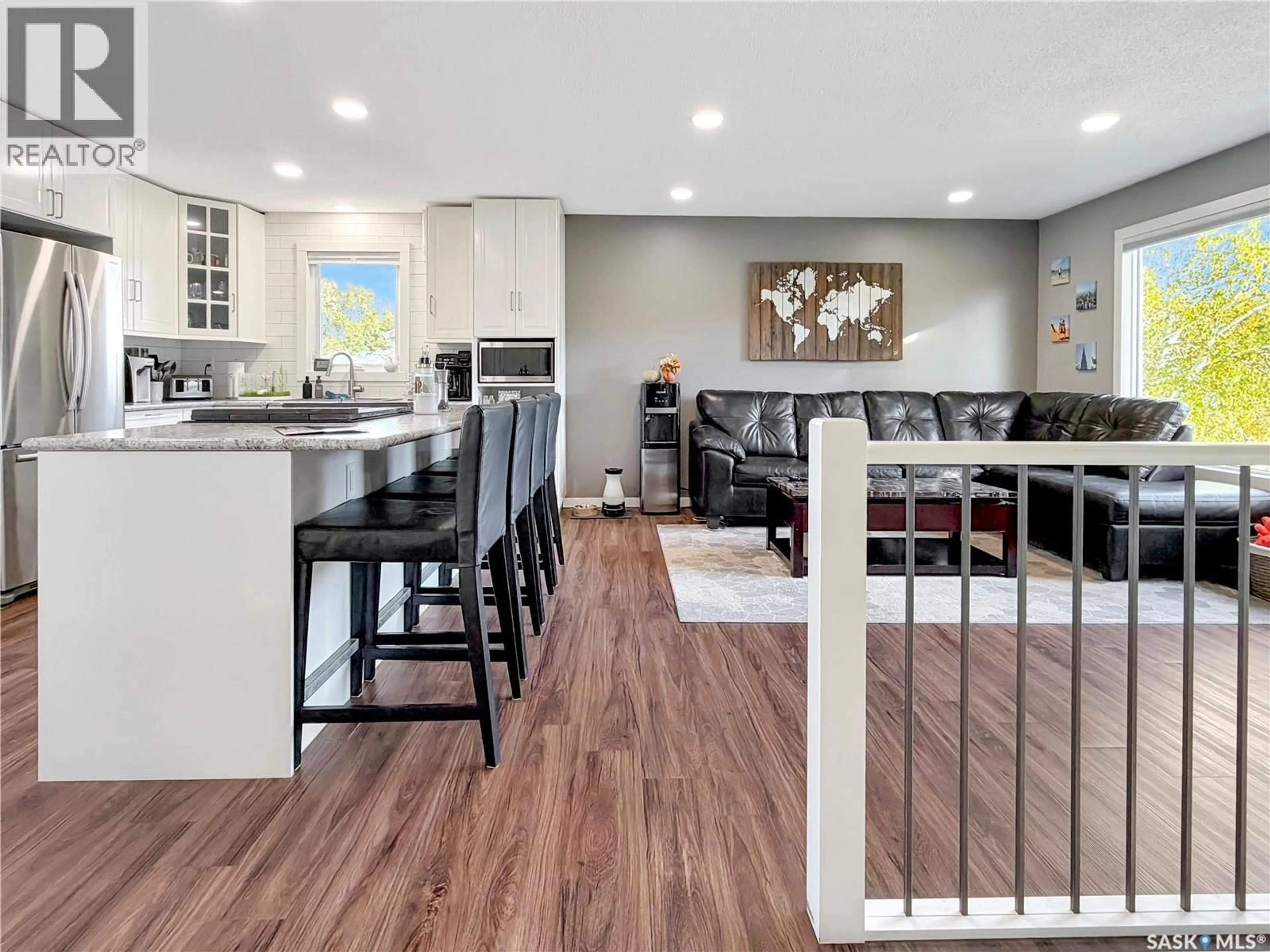 Open concept kitchen, wood/laminate floor for 23 WEAVER CRESCENT, Swift Current Saskatchewan S9H4B8