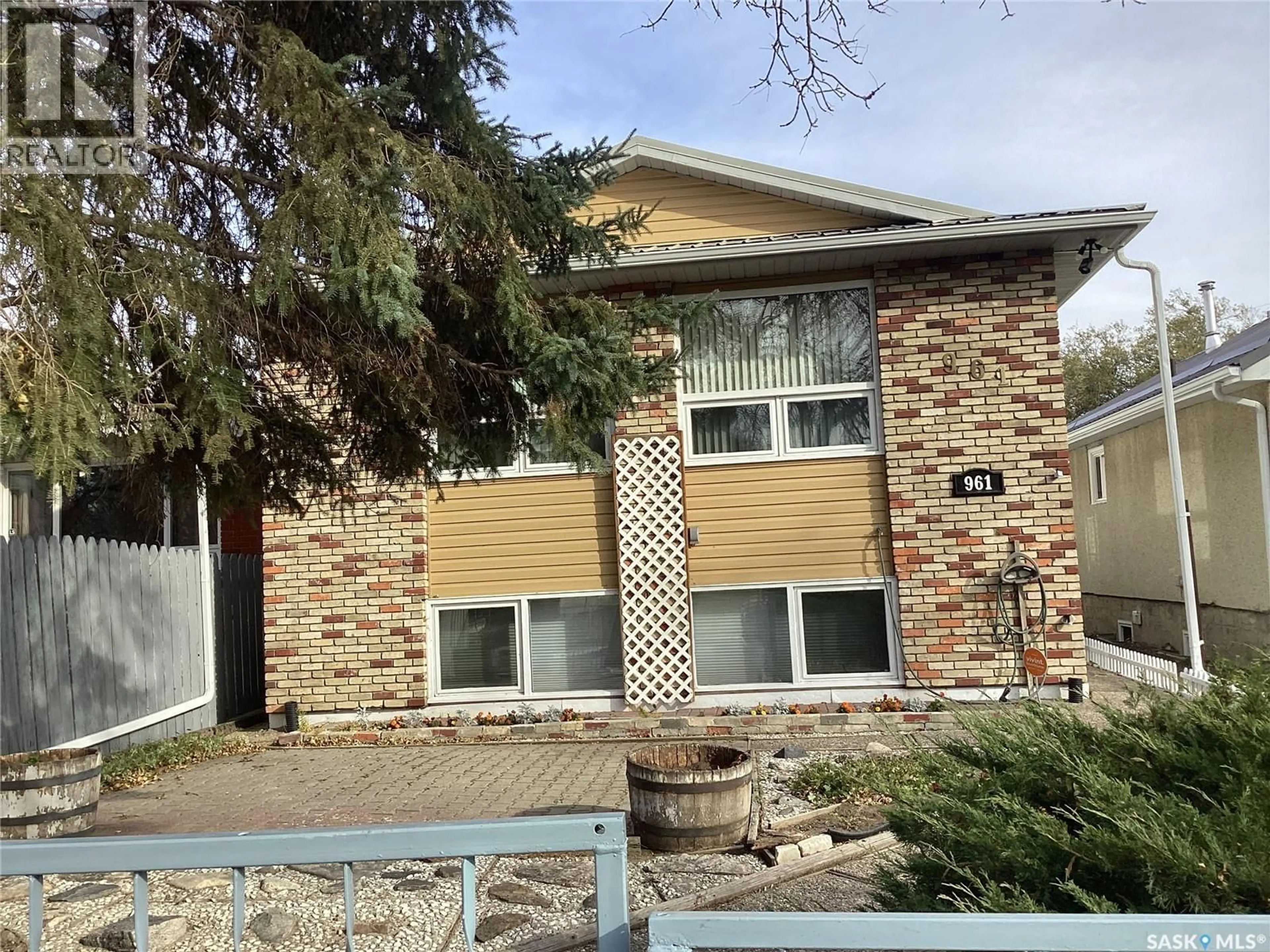 Home with brick exterior material, street for 961 ATHOL STREET, Regina Saskatchewan S4T3B8