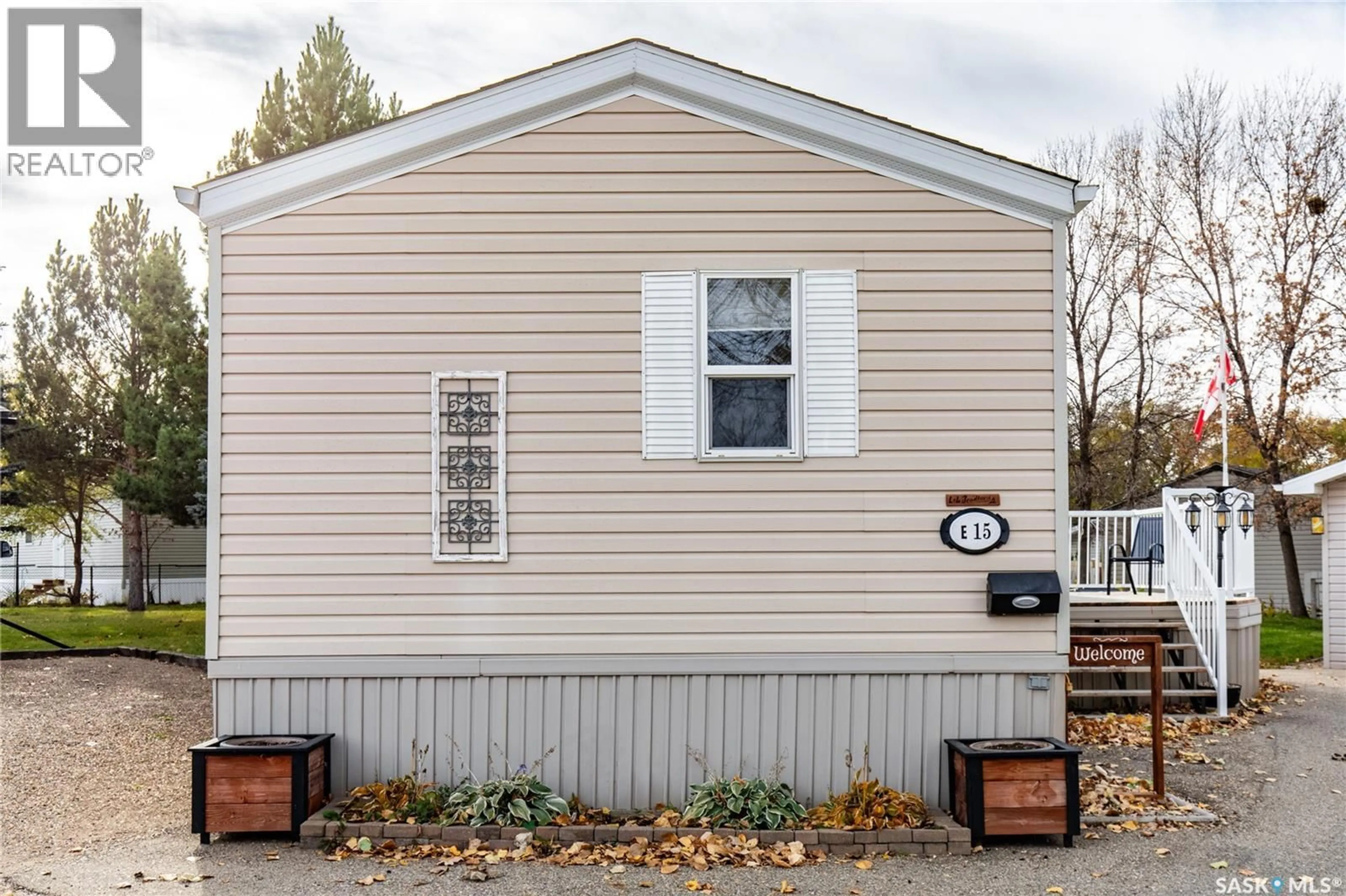 Home with vinyl exterior material, street for E15 - 1455 9TH AVENUE, Moose Jaw Saskatchewan S6J1C6