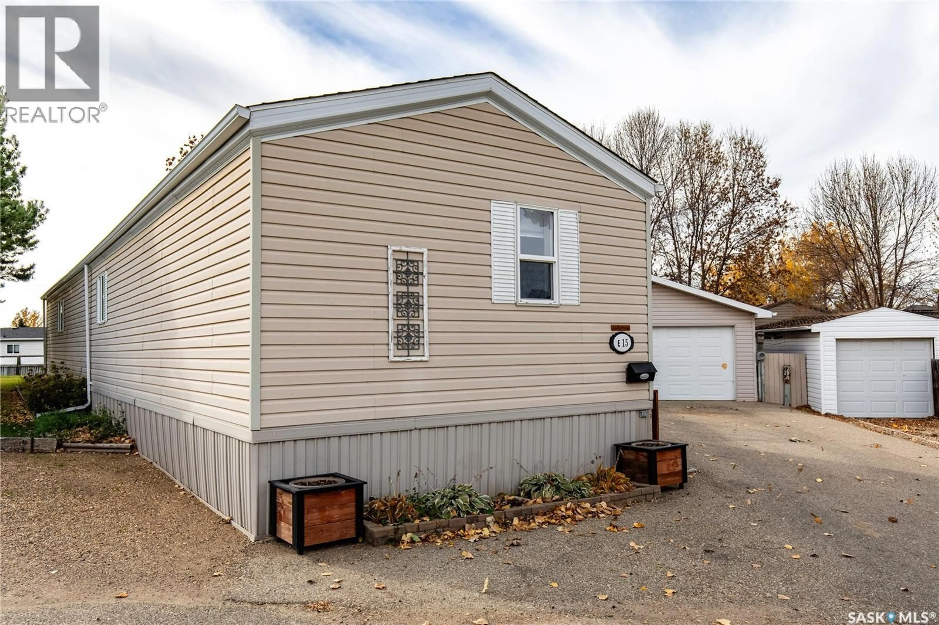 Home with vinyl exterior material, street for E15 - 1455 9TH AVENUE, Moose Jaw Saskatchewan S6J1C6