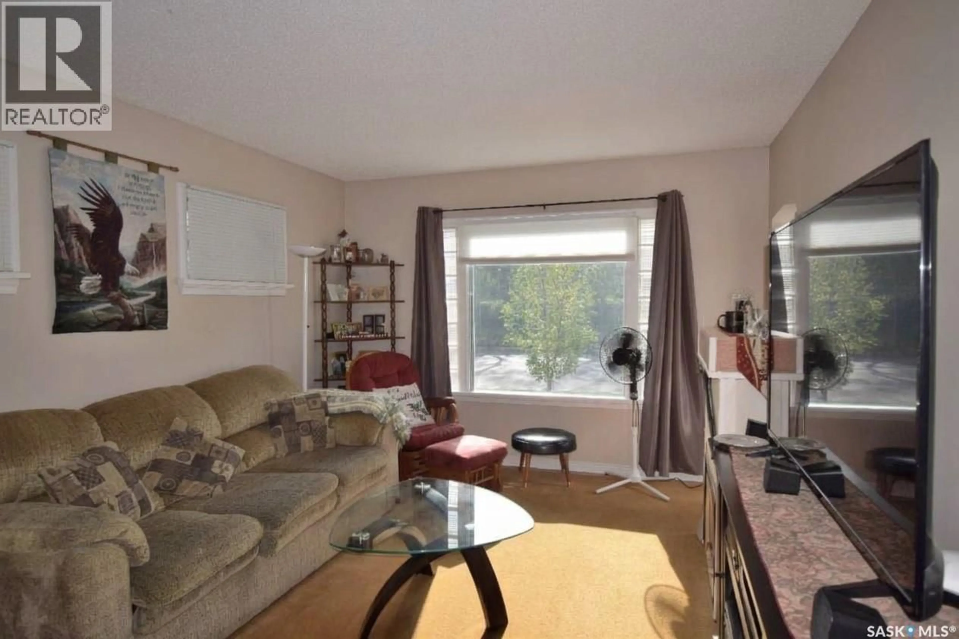 Living room with furniture, wood/laminate floor for 532 13TH STREET, Prince Albert Saskatchewan S6V3G7
