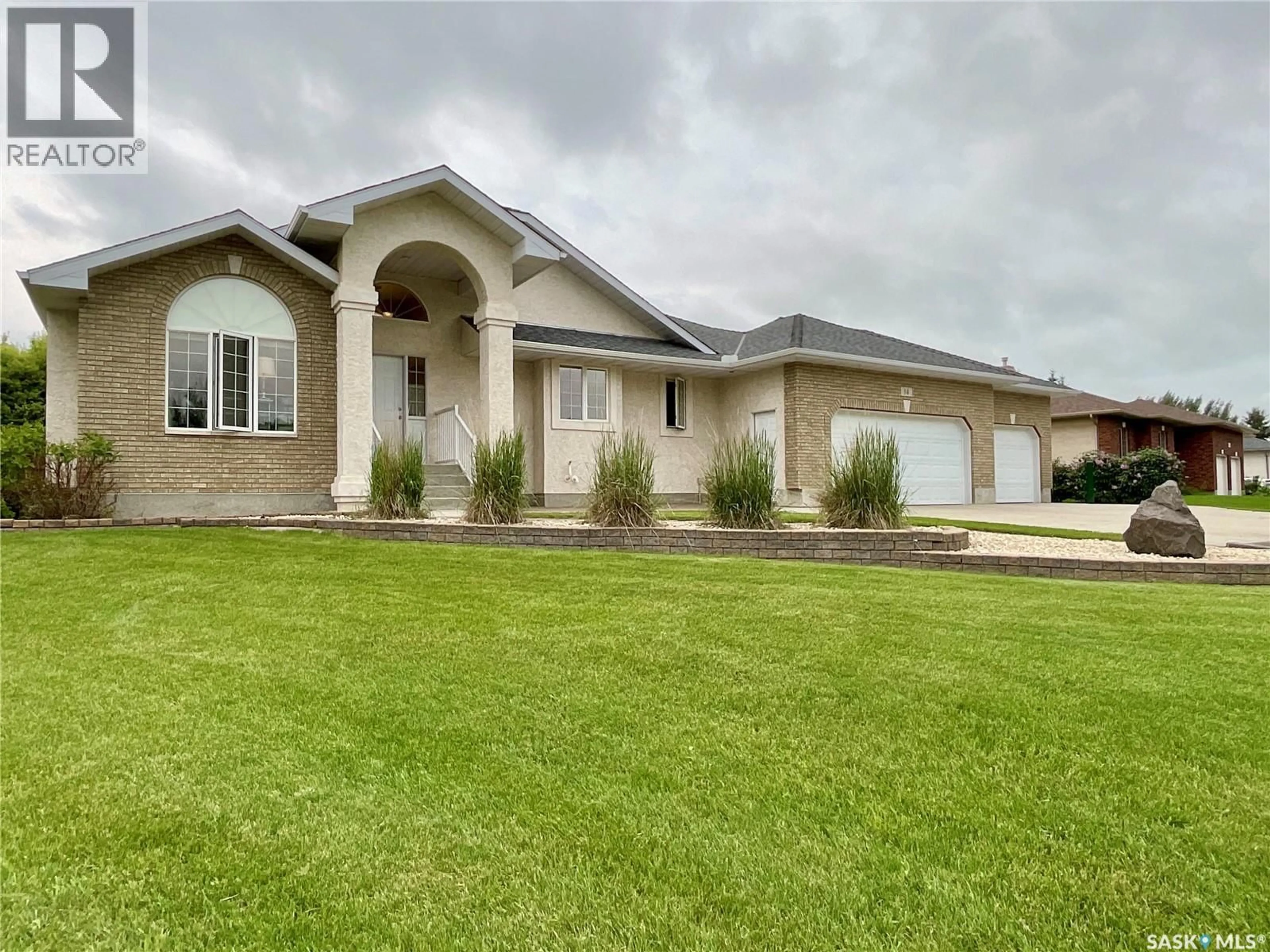 Home with vinyl exterior material, street for 14 LOTT ROAD, White City Saskatchewan S4L5B1