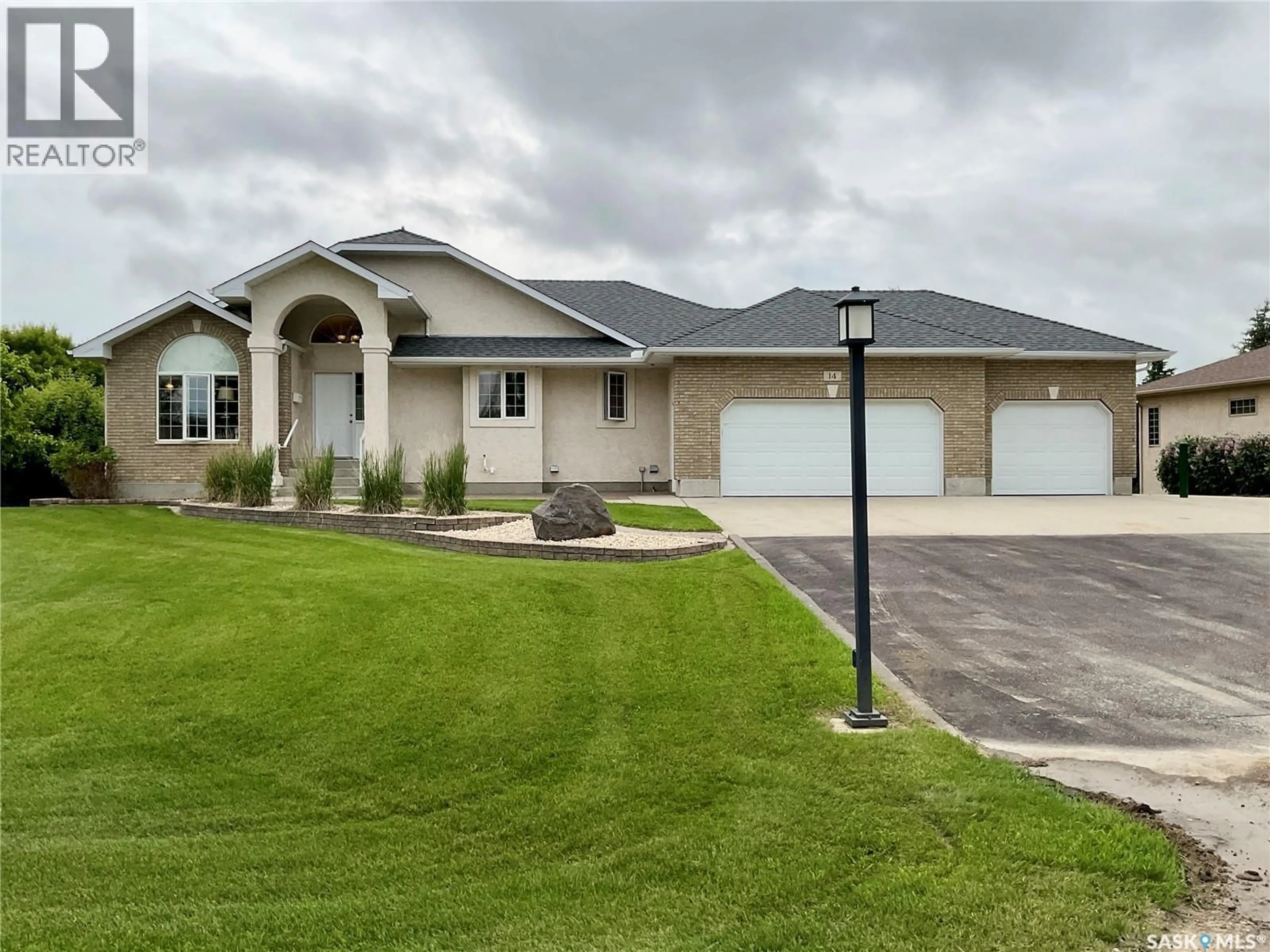 Home with vinyl exterior material, street for 14 LOTT ROAD, White City Saskatchewan S4L5B1