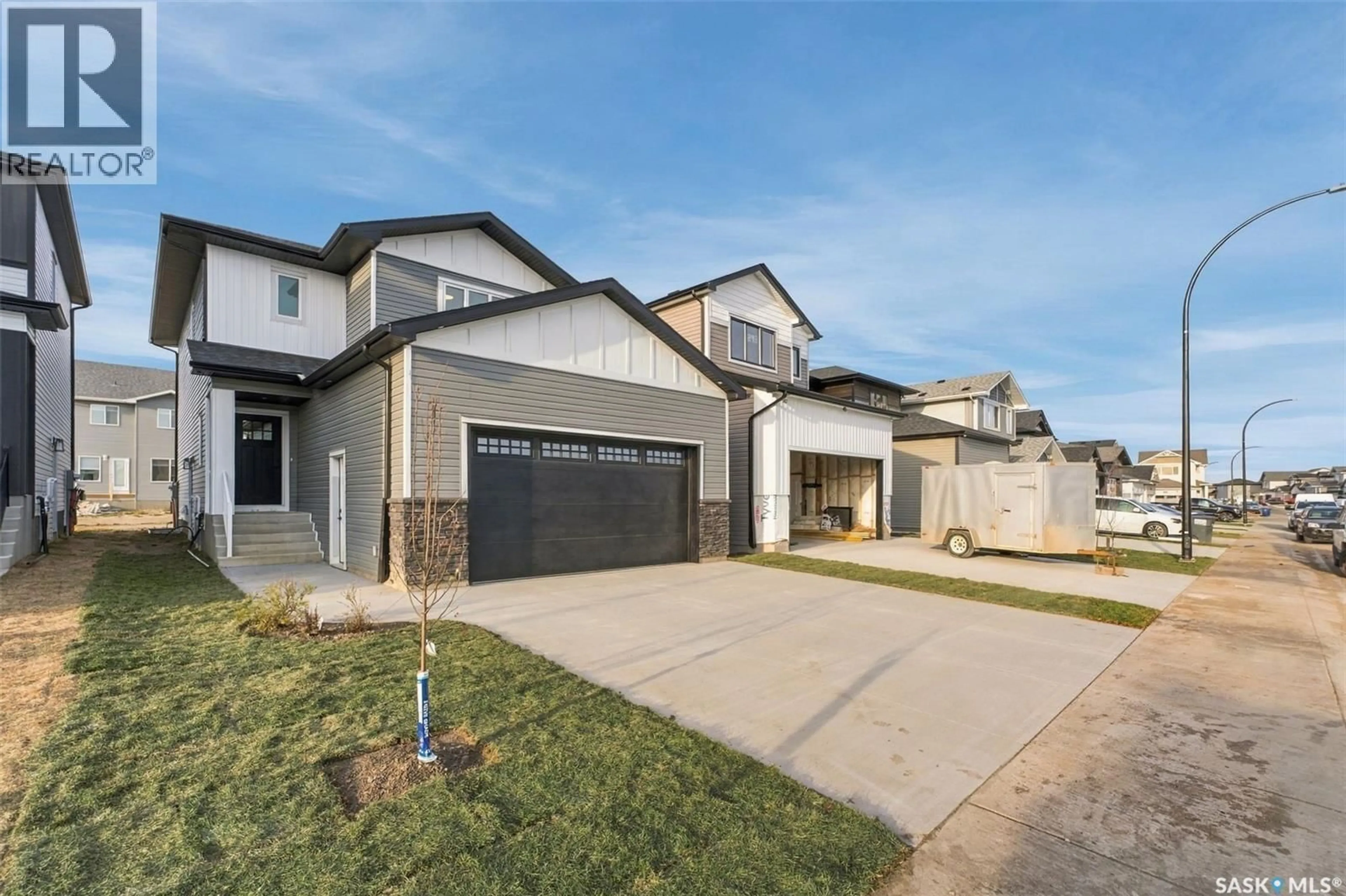 Home with brick exterior material, street for 247 DORAN WAY, Saskatoon Saskatchewan S7V1Z3