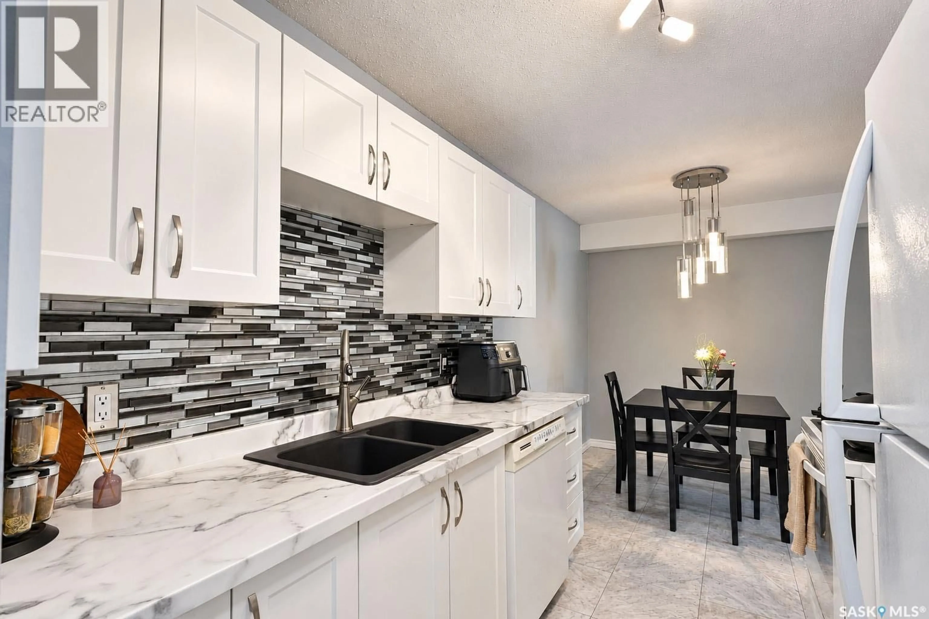 Open concept kitchen, ceramic/tile floor for 105 - 1580 OLIVE DIEFENBAKER DRIVE, Prince Albert Saskatchewan S6V7M6