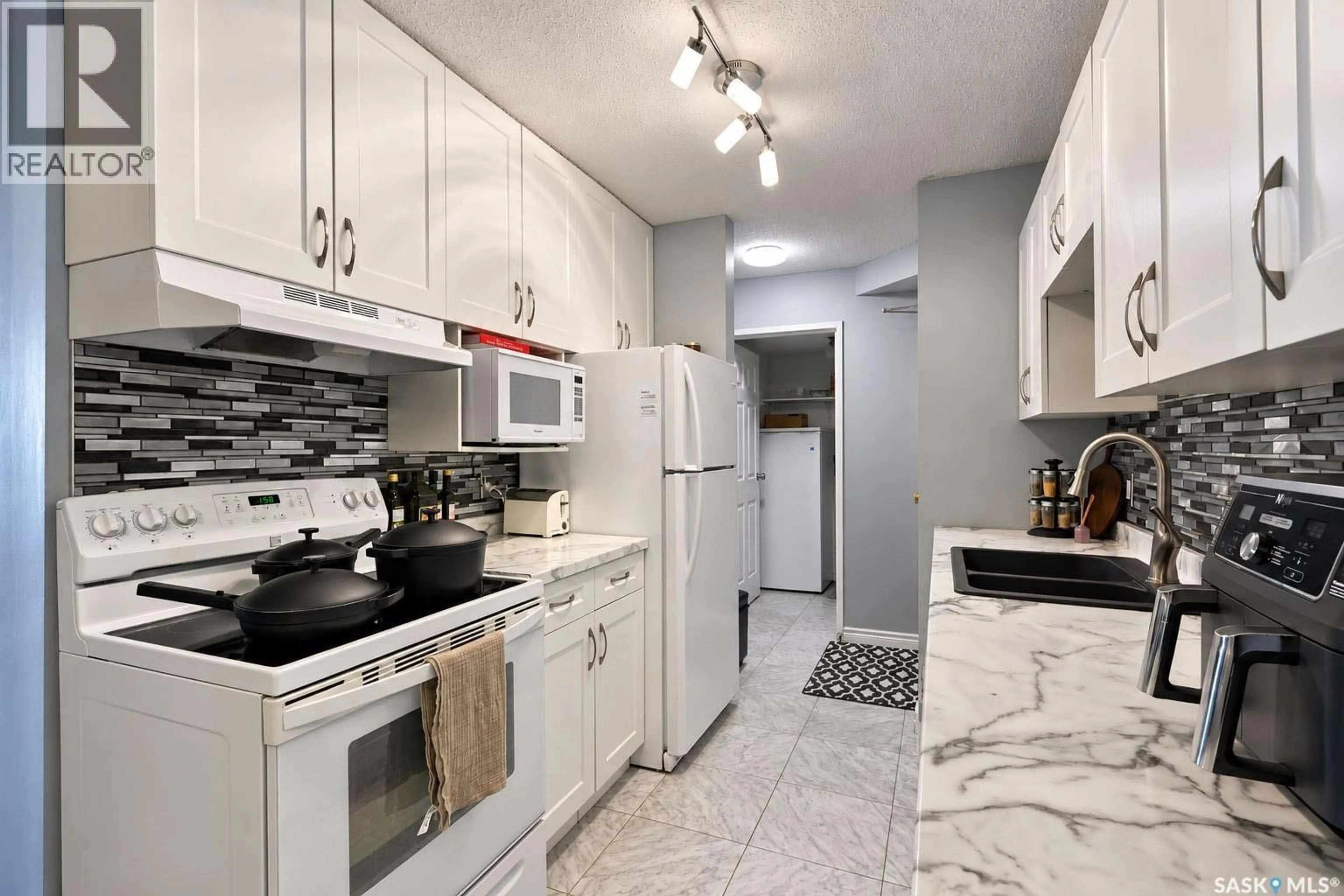 Standard kitchen, ceramic/tile floor for 105 - 1580 OLIVE DIEFENBAKER DRIVE, Prince Albert Saskatchewan S6V7M6