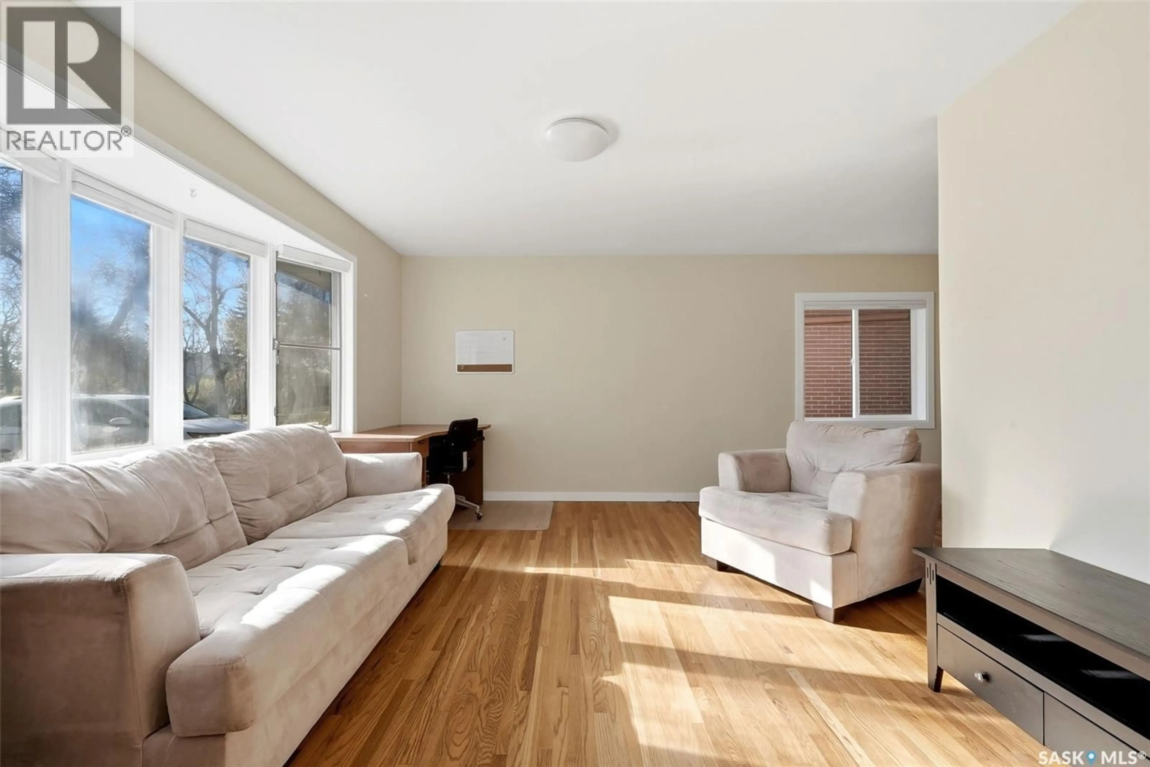 Living room with furniture, wood/laminate floor for 3548 ALLEN AVENUE, Regina Saskatchewan S4S0Z9
