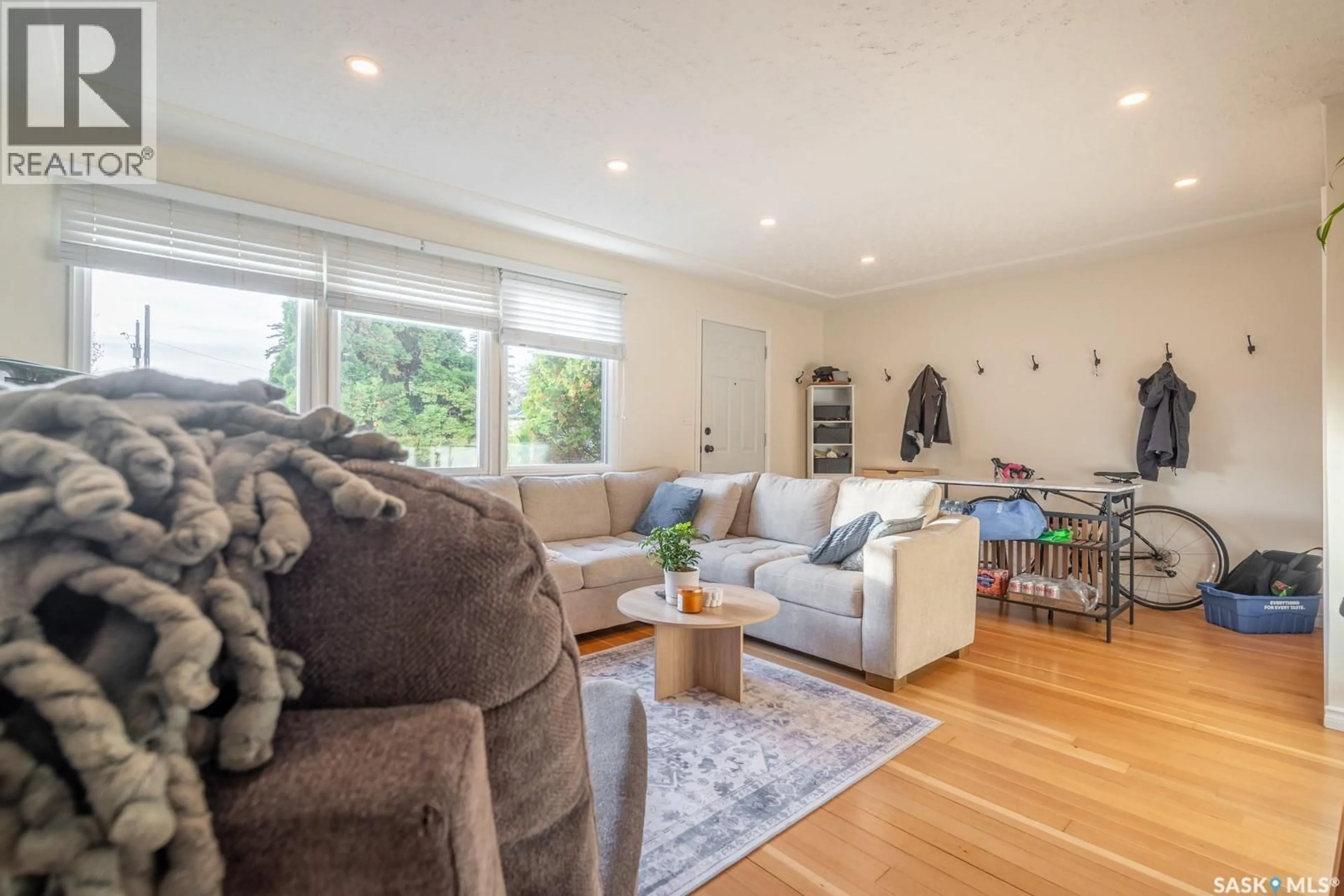 Living room with furniture, wood/laminate floor for 2819 MCDONALD STREET, Regina Saskatchewan S4N3A1