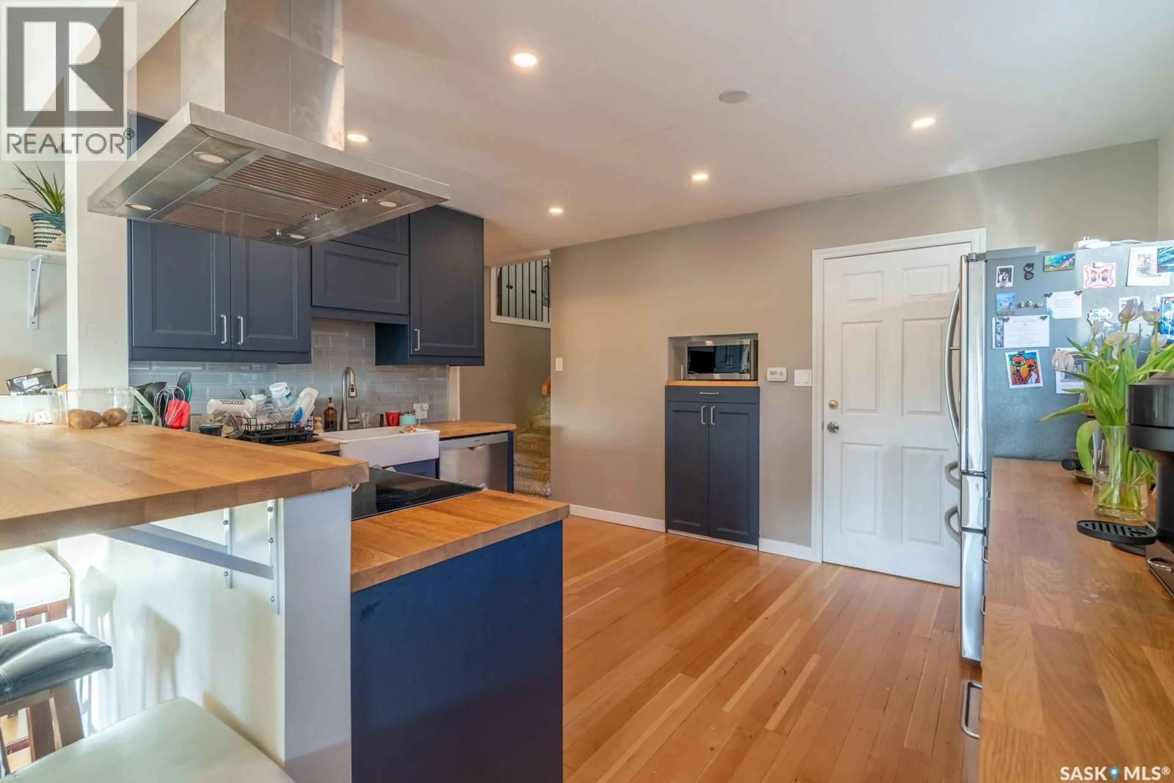 Open concept kitchen, wood/laminate floor for 2819 MCDONALD STREET, Regina Saskatchewan S4N3A1