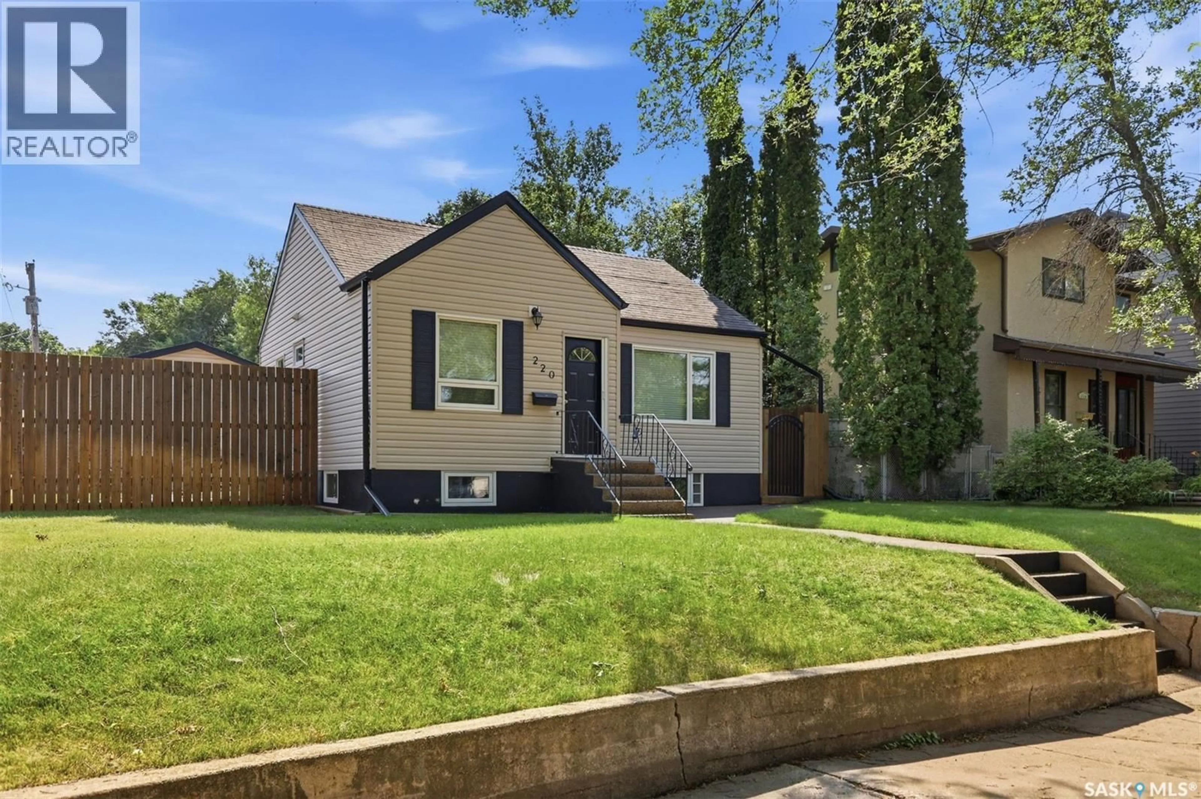 Home with vinyl exterior material, street for 220 3RD STREET, Saskatoon Saskatchewan S7H1L3