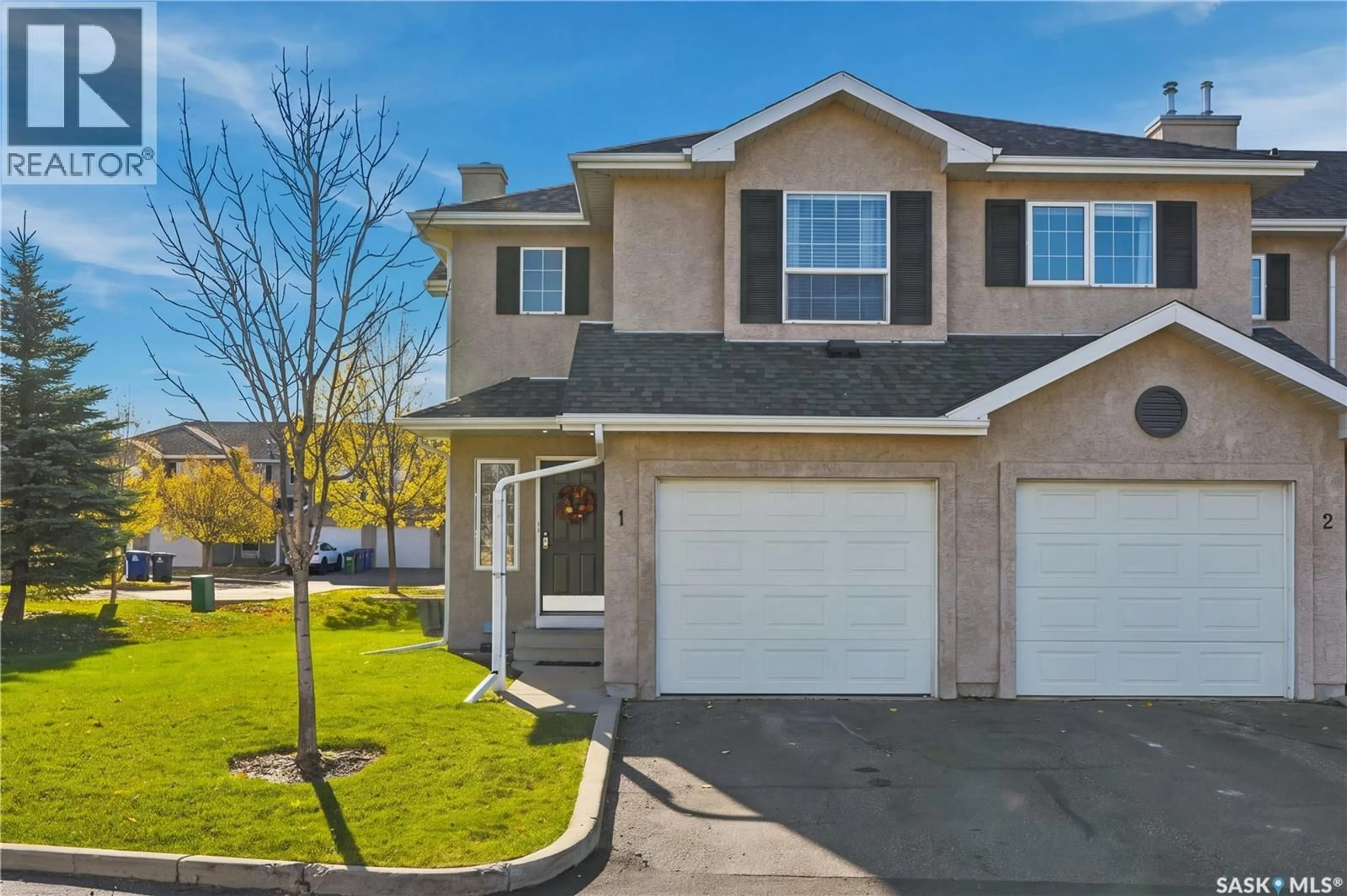 Home with vinyl exterior material, street for 1 - 127 BANYAN CRESCENT, Saskatoon Saskatchewan S7V1G5