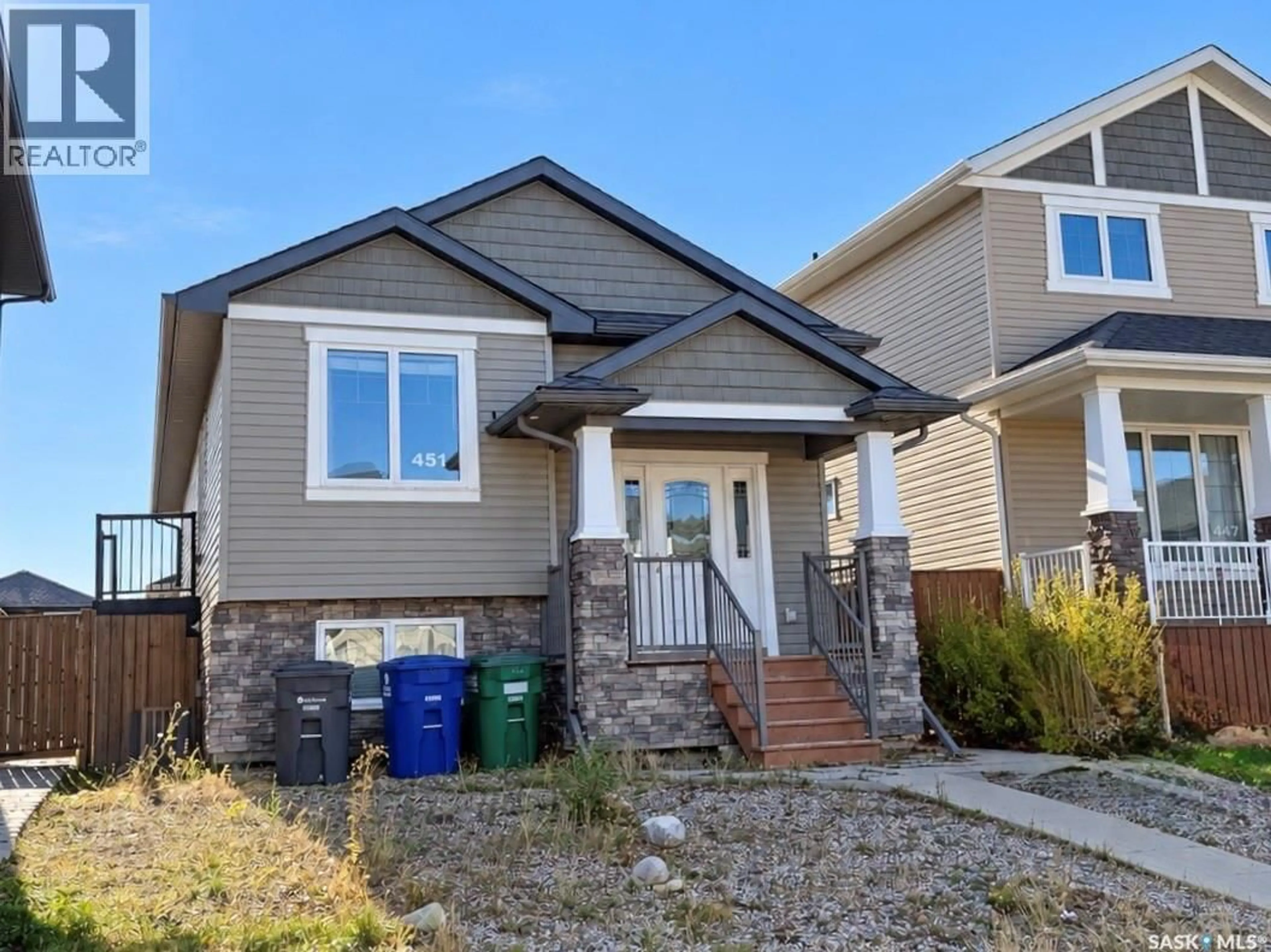 Home with vinyl exterior material, street for 451 KLOPPENBURG STREET, Saskatoon Saskatchewan S7N4H2