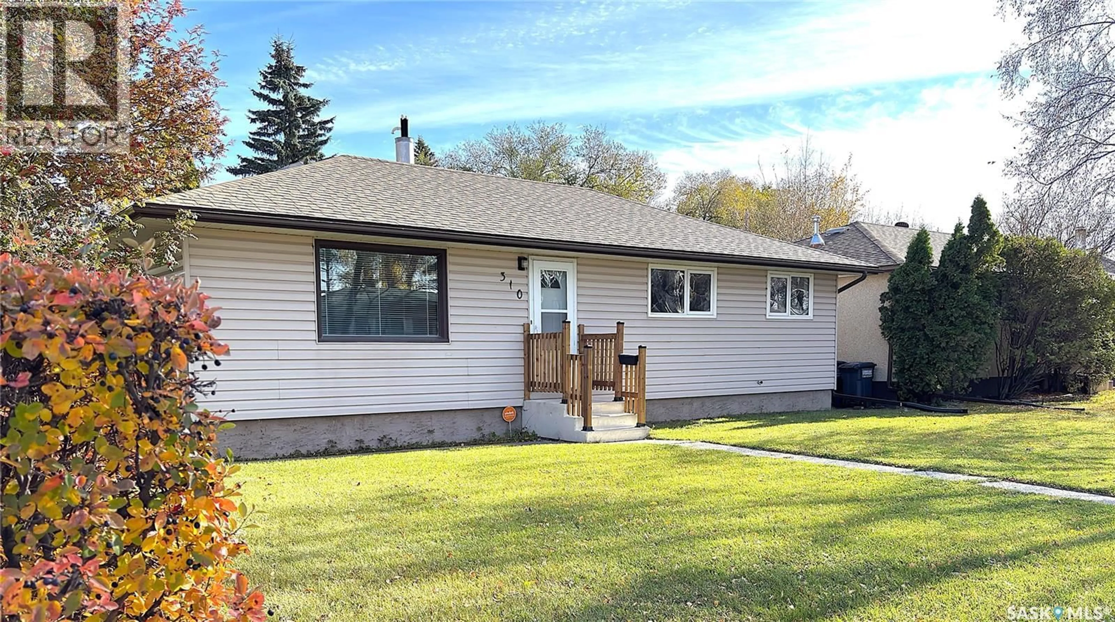 Home with vinyl exterior material, street for 310 VANCOUVER AVENUE, Saskatoon Saskatchewan S7M3N1