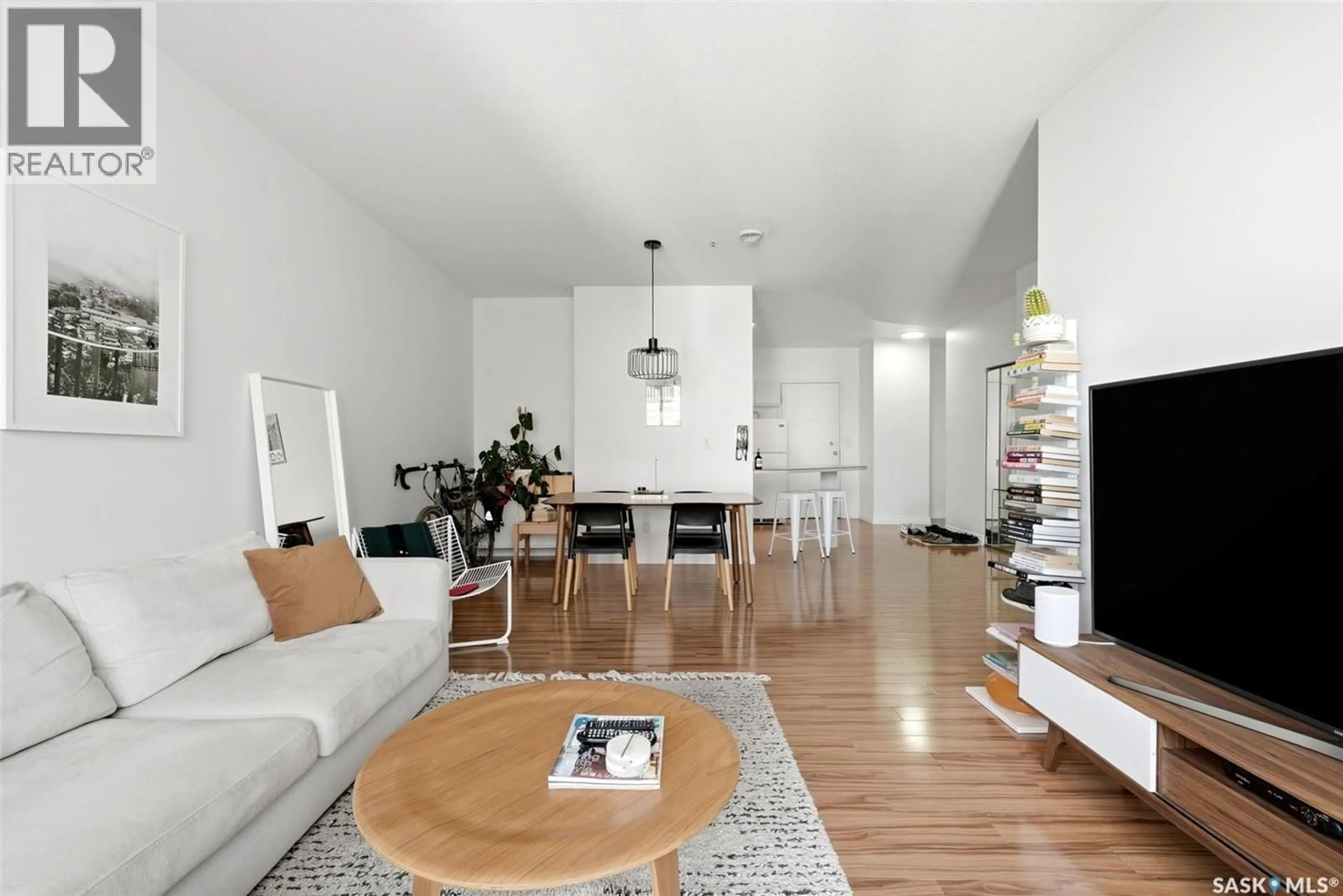 Living room with furniture, wood/laminate floor for 506 - 1867 HAMILTON STREET, Regina Saskatchewan S4P2C2