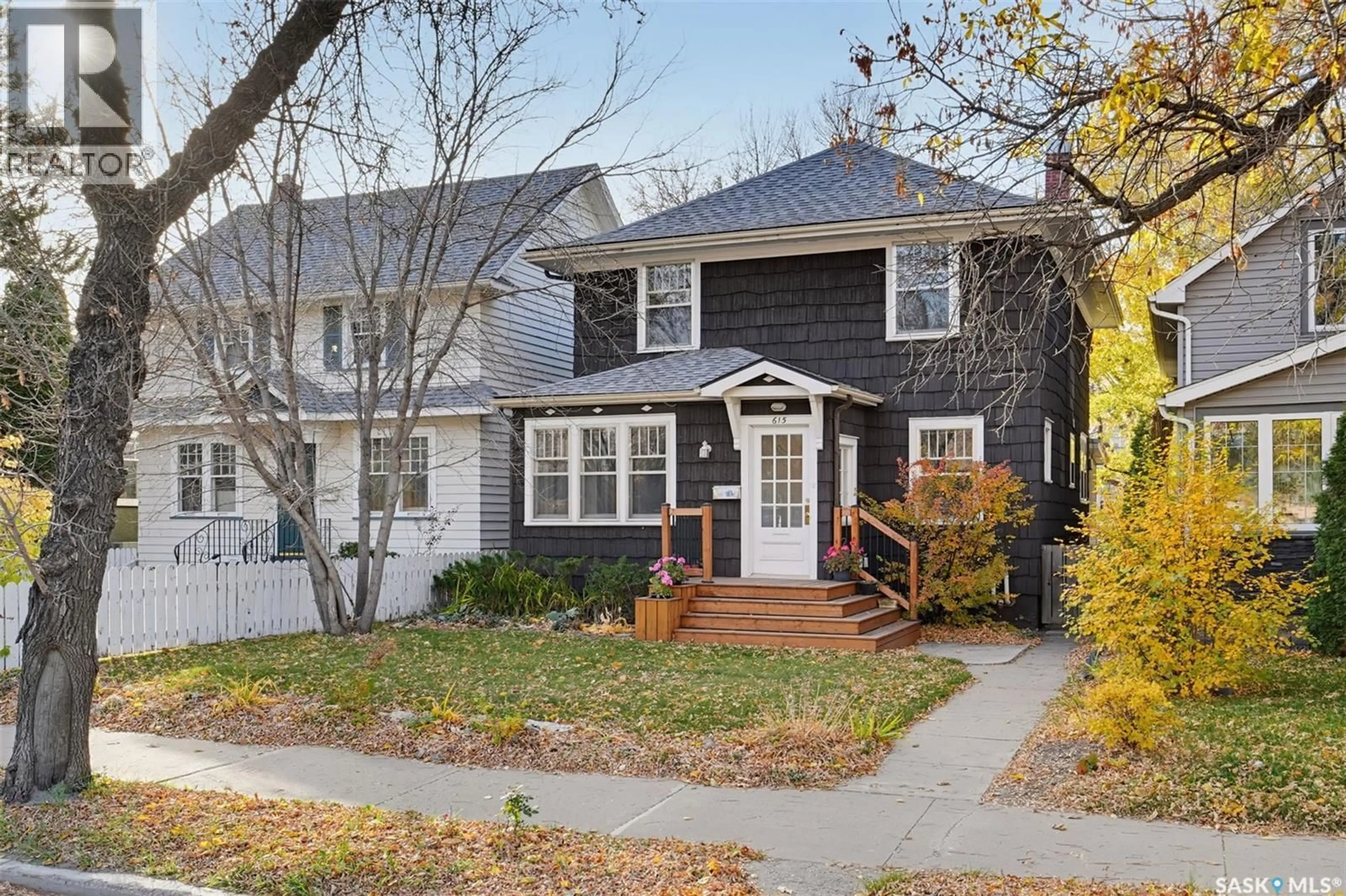 Home with vinyl exterior material, street for 615 CLARENCE AVENUE, Saskatoon Saskatchewan S7H2E1
