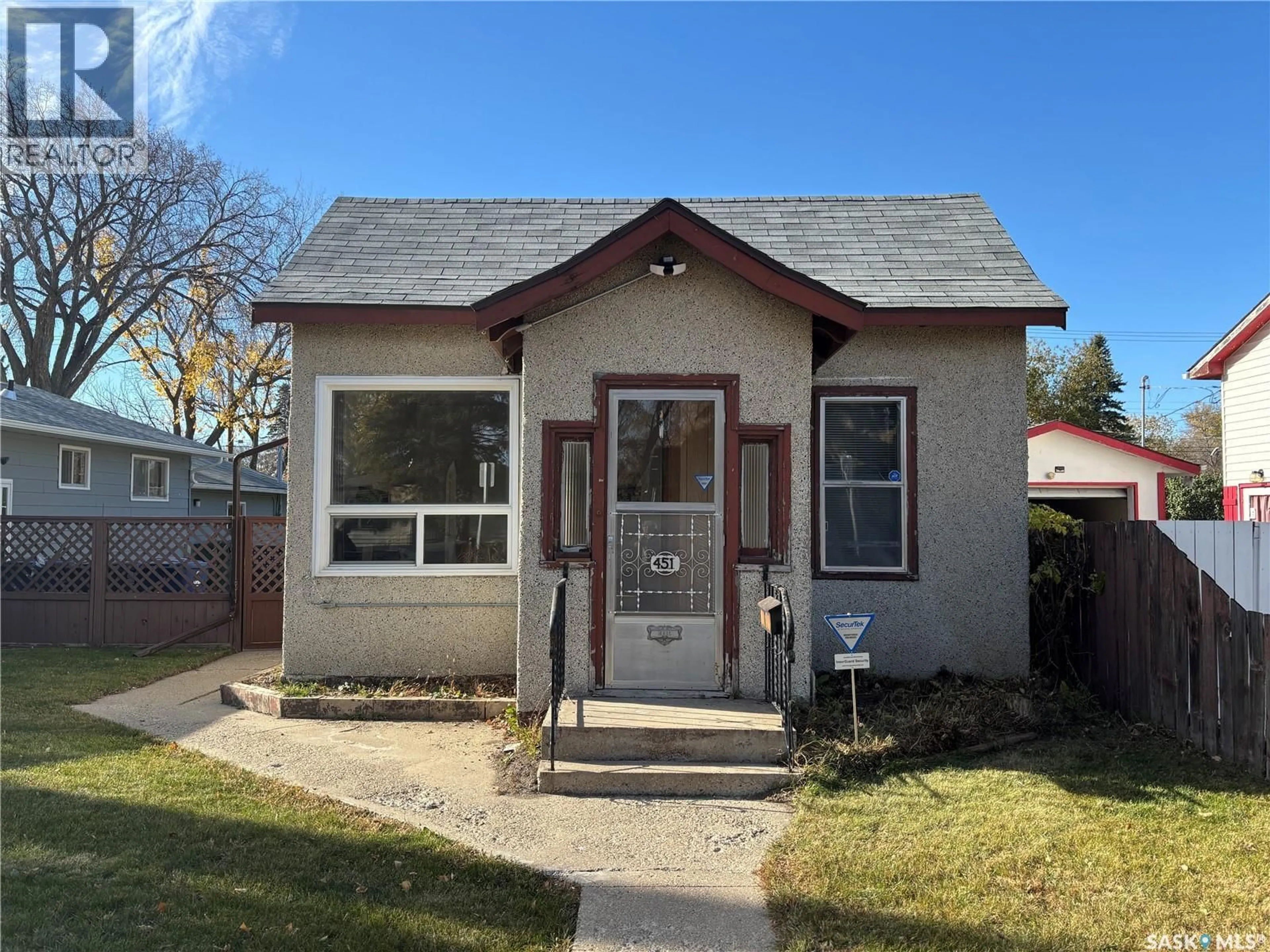 Home with brick exterior material, street for 451 T AVENUE, Saskatoon Saskatchewan S7M3B3