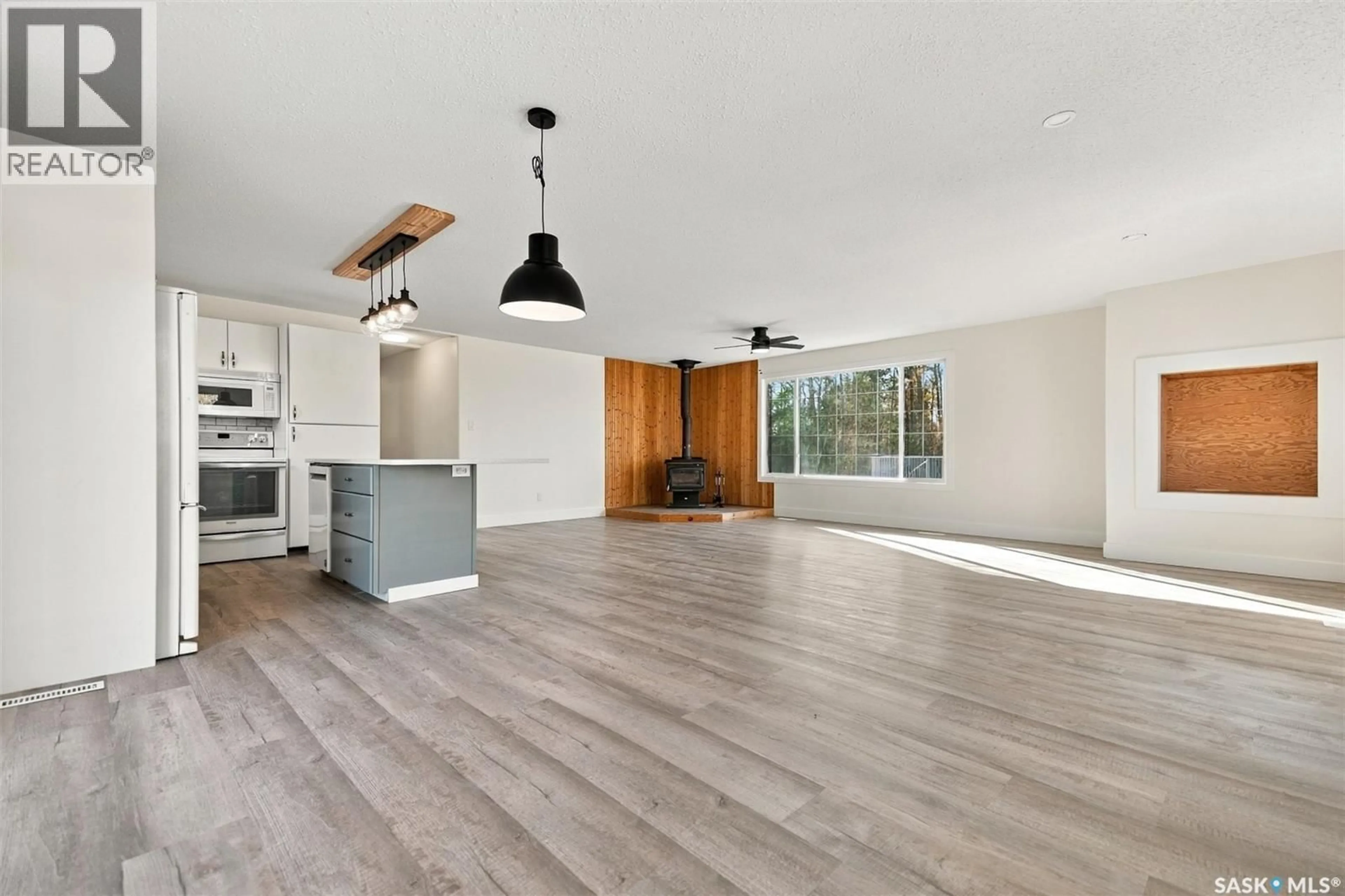 Open concept kitchen, wood/laminate floor for 28 101 NEIS ACCESS ROAD, Emma Lake Saskatchewan S0J0N0