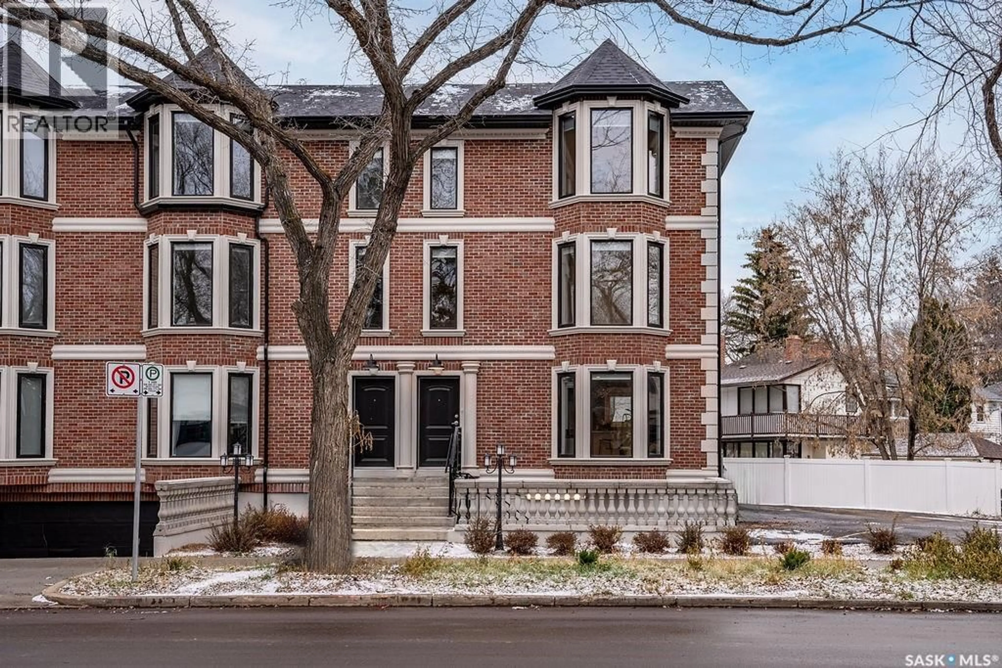 Home with brick exterior material, street for 1007 OSLER STREET, Saskatoon Saskatchewan S7N0T5