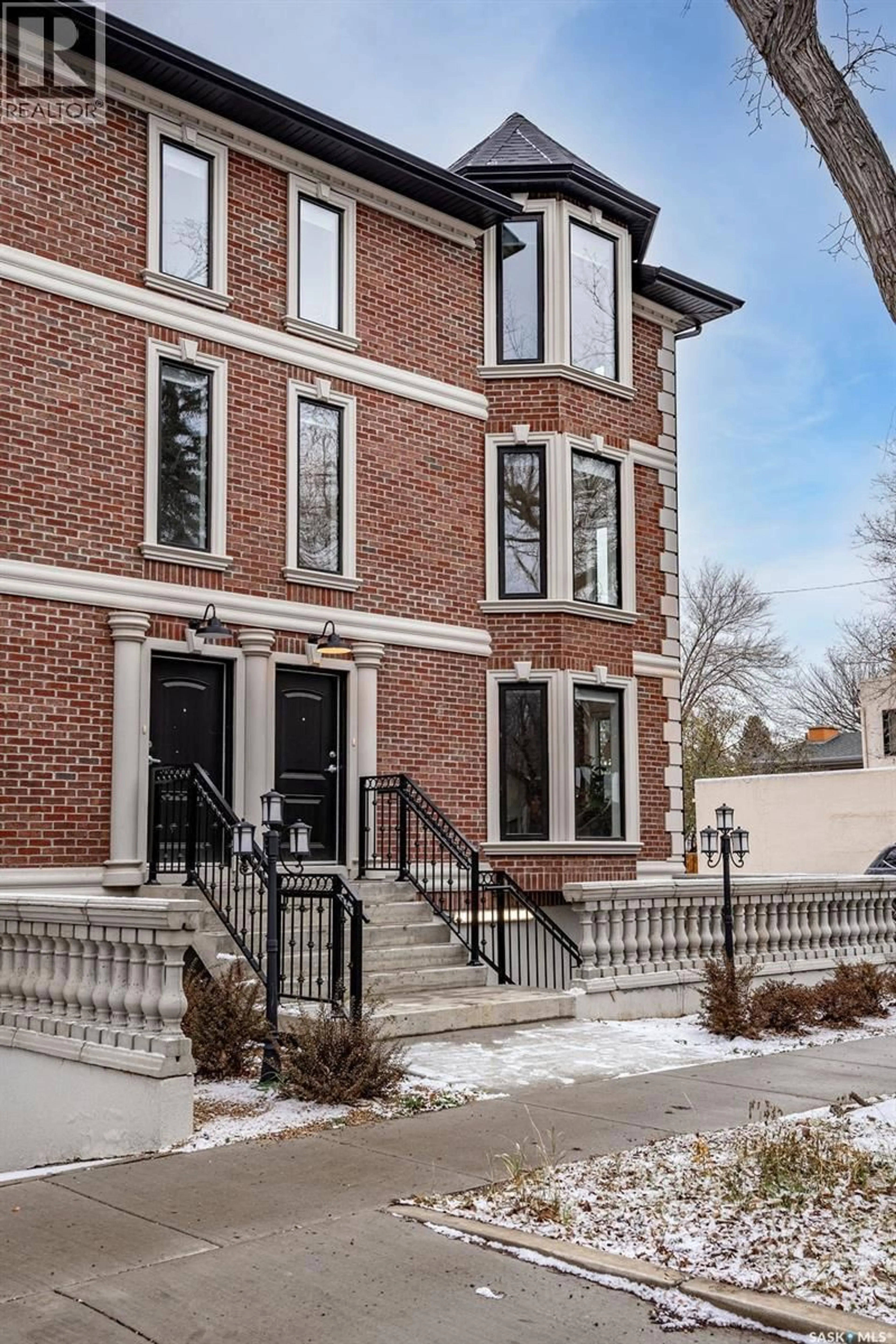 Home with brick exterior material, street for 1007 OSLER STREET, Saskatoon Saskatchewan S7N0T5