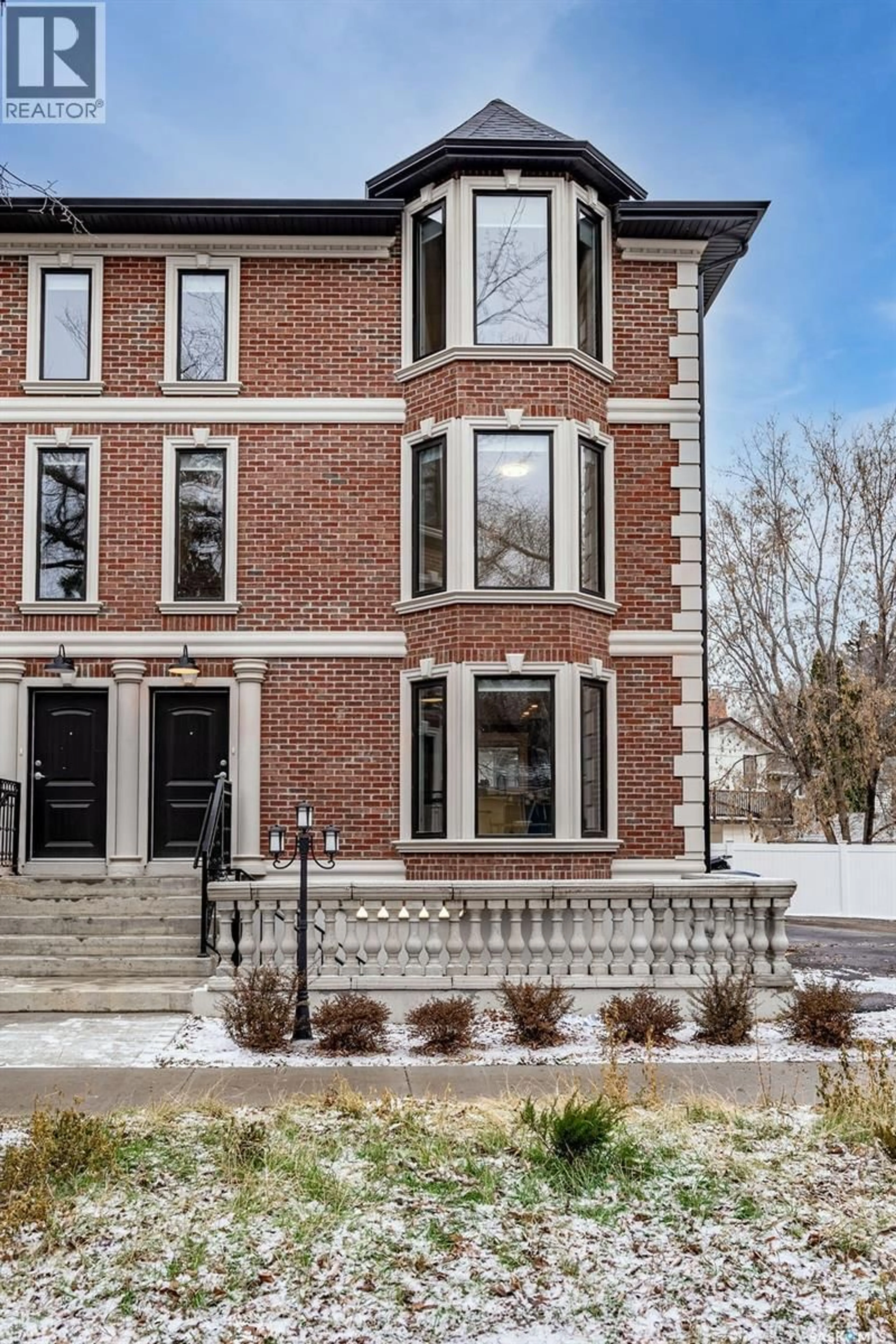 Home with brick exterior material, street for 1007 OSLER STREET, Saskatoon Saskatchewan S7N0T5