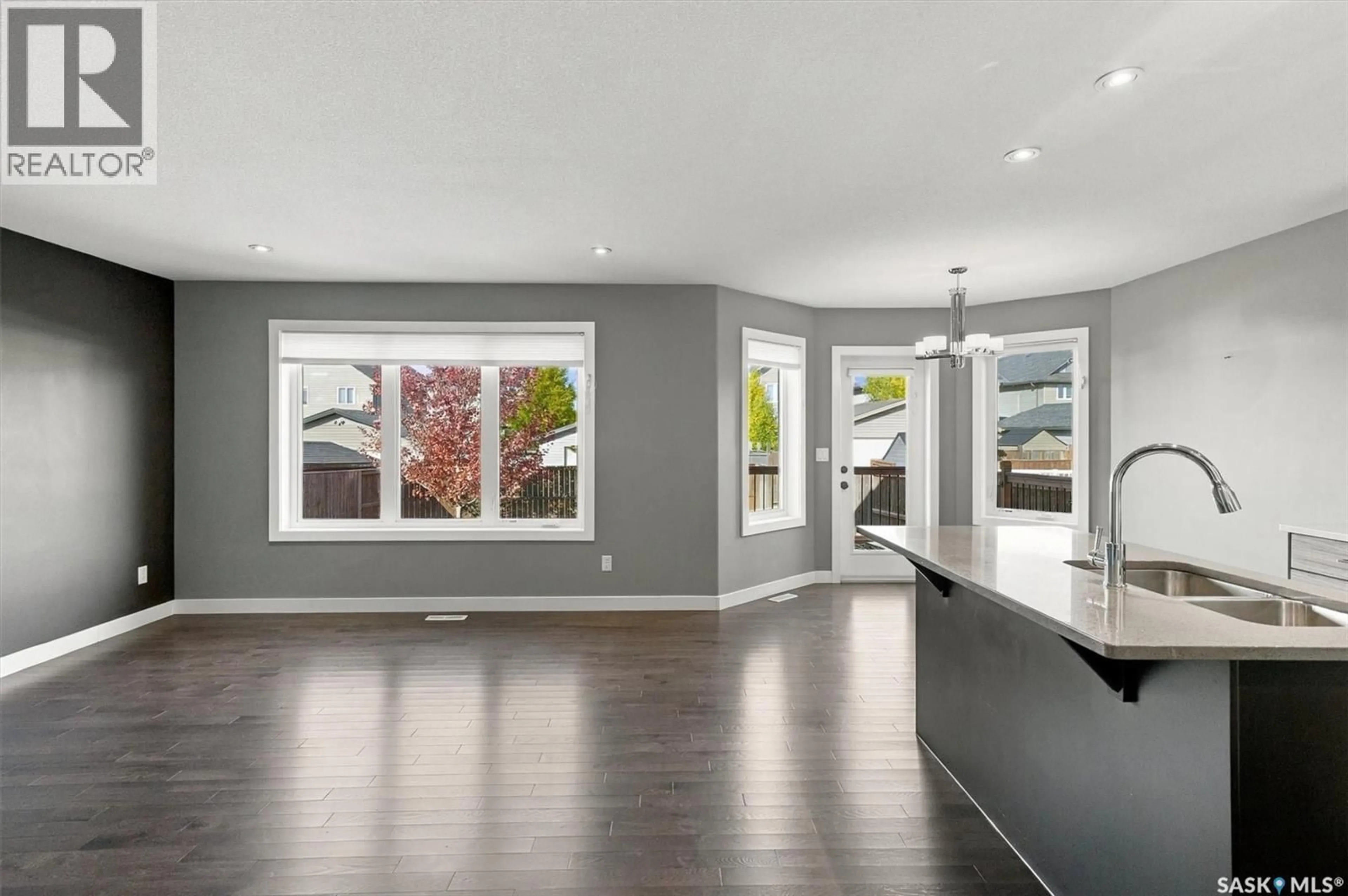 Open concept kitchen, wood/laminate floor for 319 LANGLOIS WAY, Saskatoon Saskatchewan S7T0M9