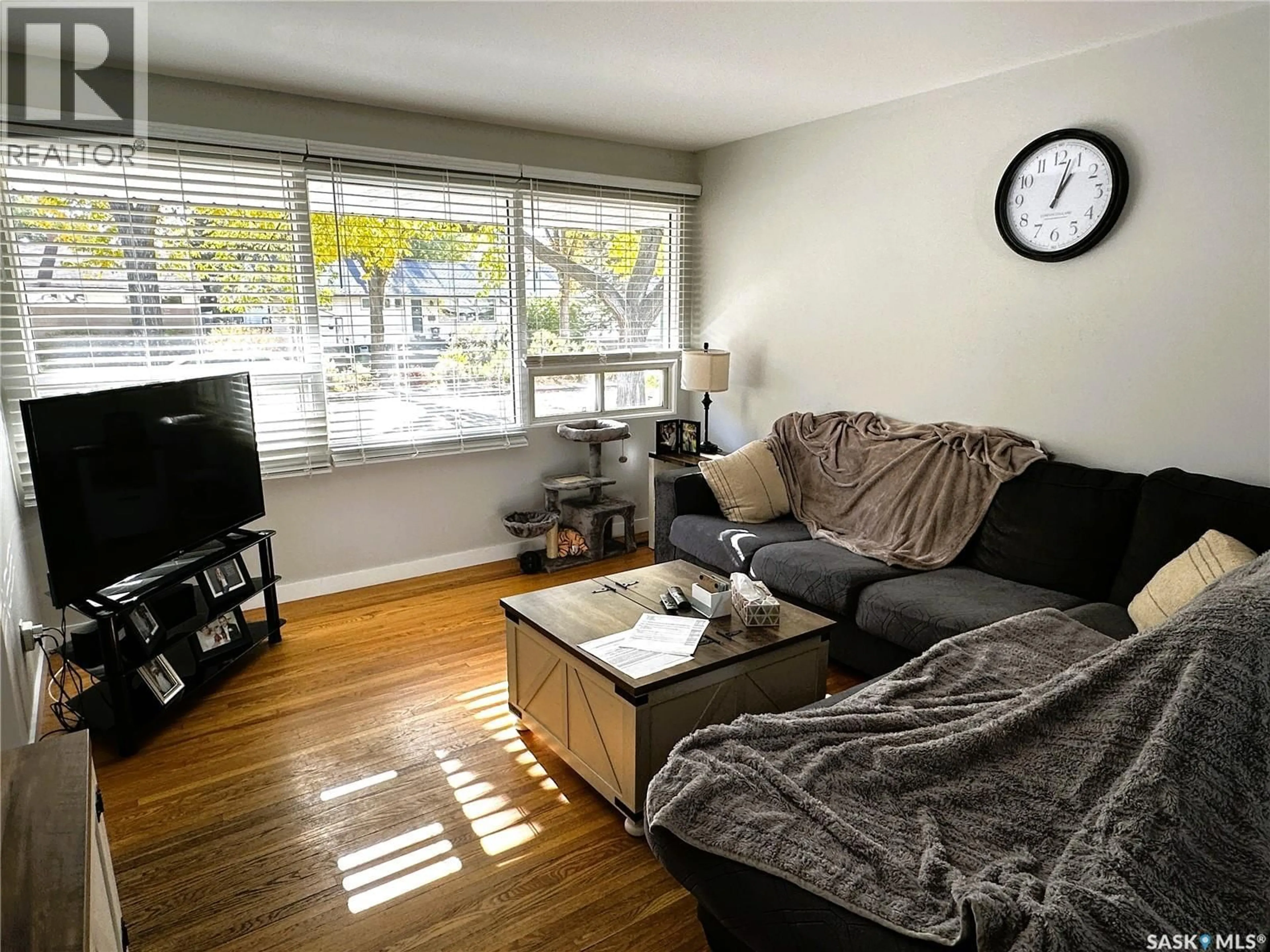 Living room with furniture, wood/laminate floor for 3818 NORMANDY AVENUE, Regina Saskatchewan S4S0Y3