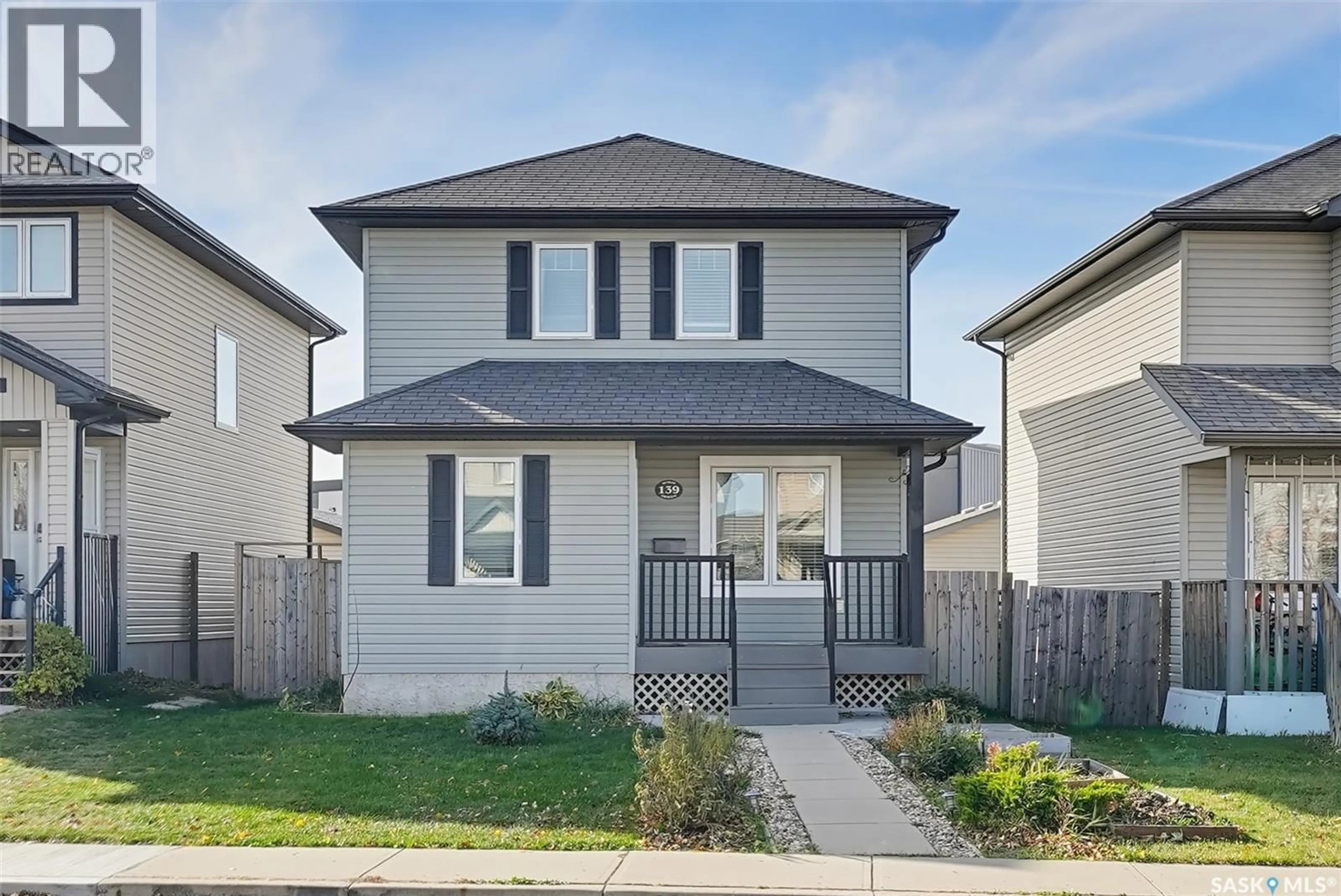 Home with vinyl exterior material, street for 139 DENHAM CRESCENT, Saskatoon Saskatchewan S7R1E9