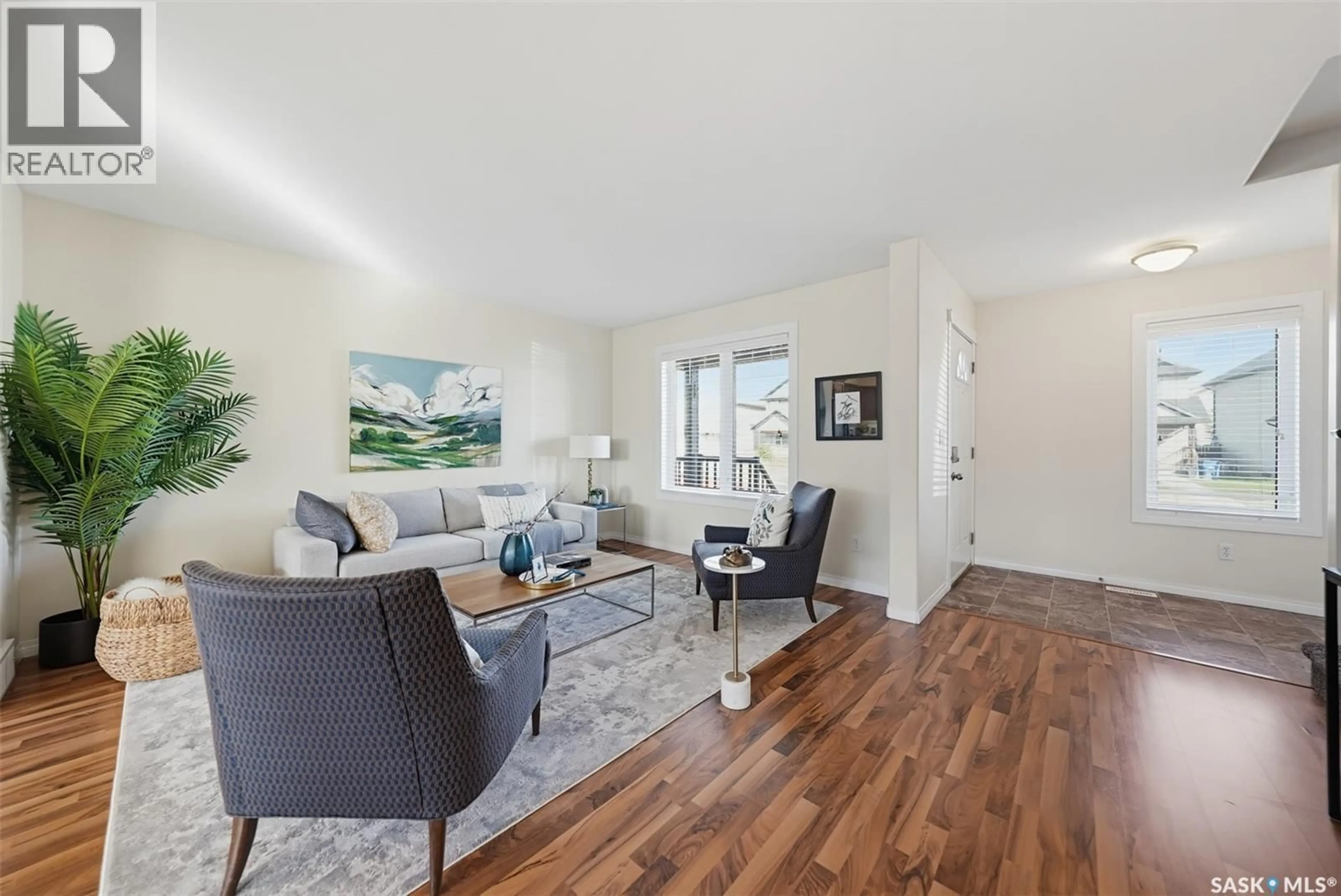 Living room with furniture, wood/laminate floor for 139 DENHAM CRESCENT, Saskatoon Saskatchewan S7R1E9