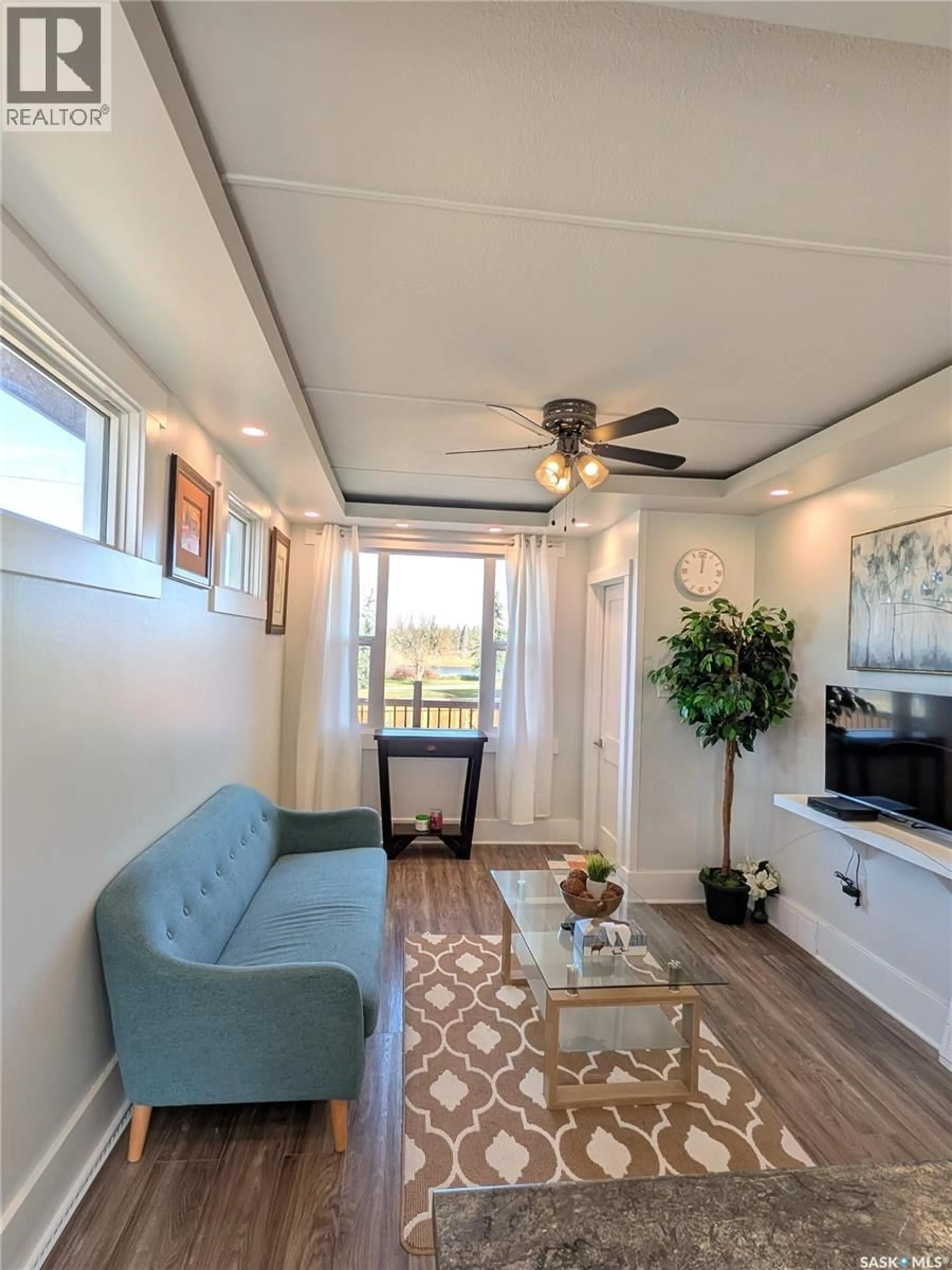 Living room with furniture, wood/laminate floor for 301 RIVER STREET, Prince Albert Saskatchewan S6V0A3