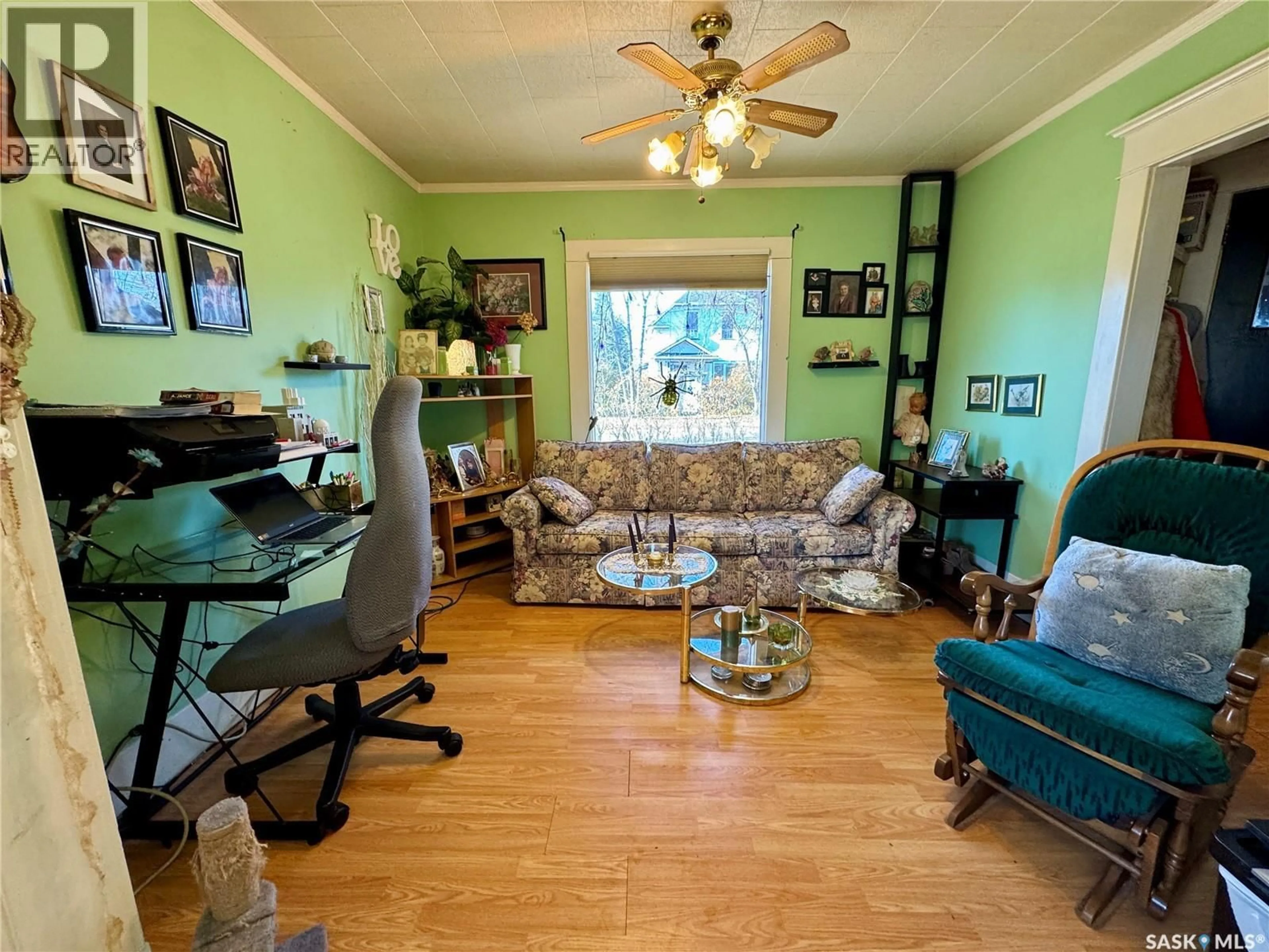 Living room with furniture, wood/laminate floor for 302 3RD STREET, Wilkie Saskatchewan S0K4W0