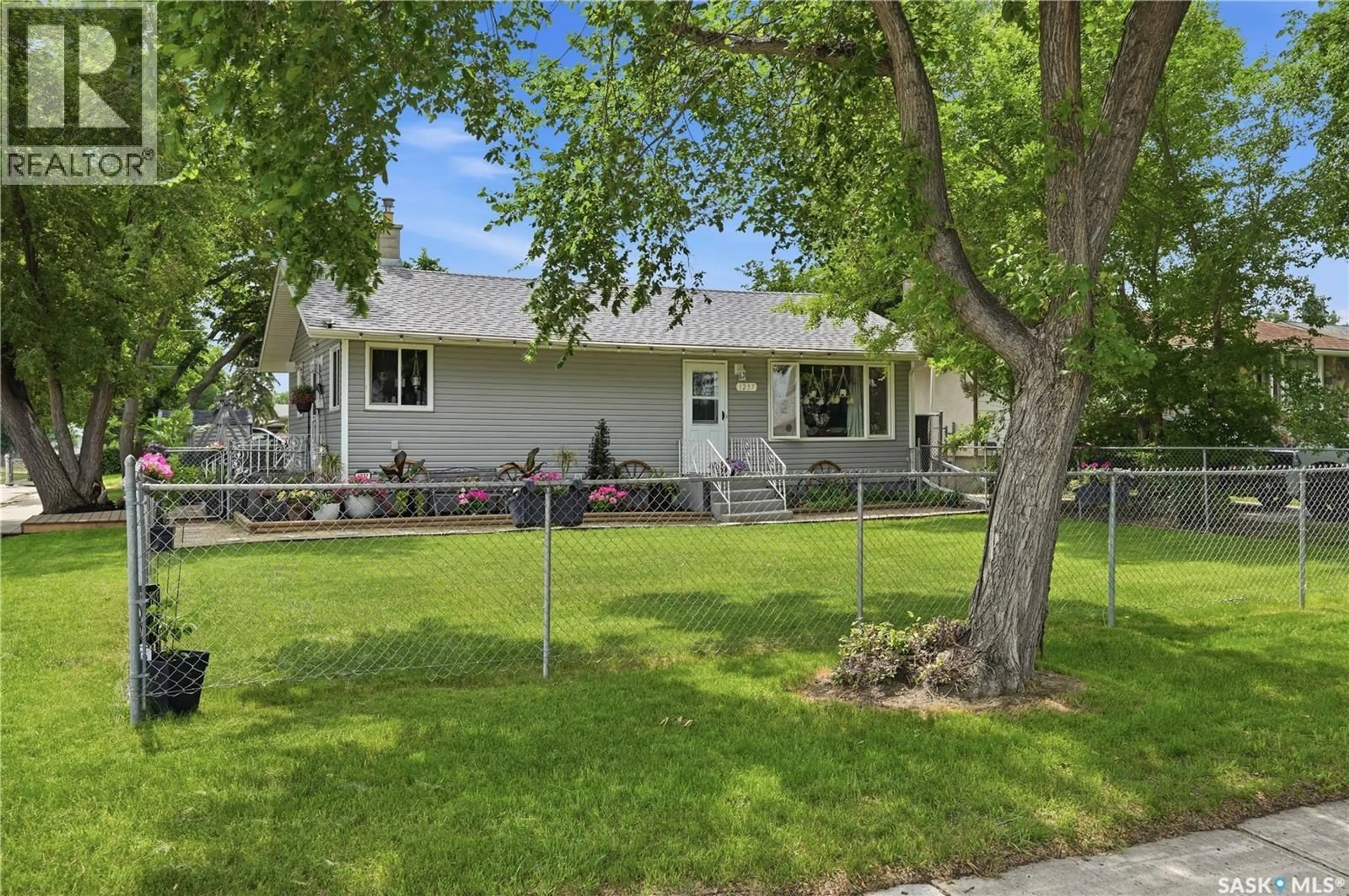 Home with vinyl exterior material, street for 1237 10TH AVENUE, Regina Saskatchewan S4N0J4