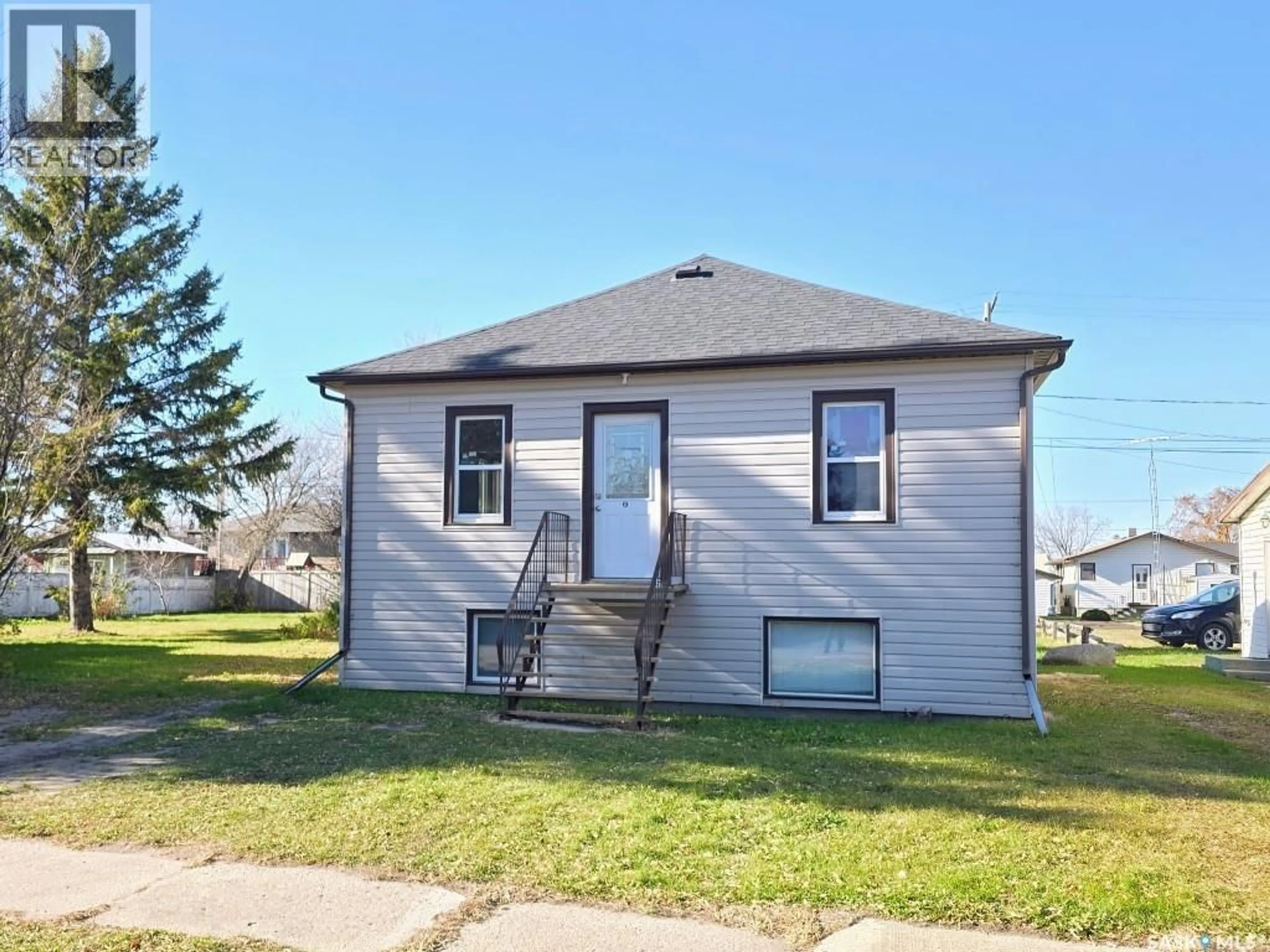 Home with vinyl exterior material, street for 319 9TH STREET, Humboldt Saskatchewan S0K2A0