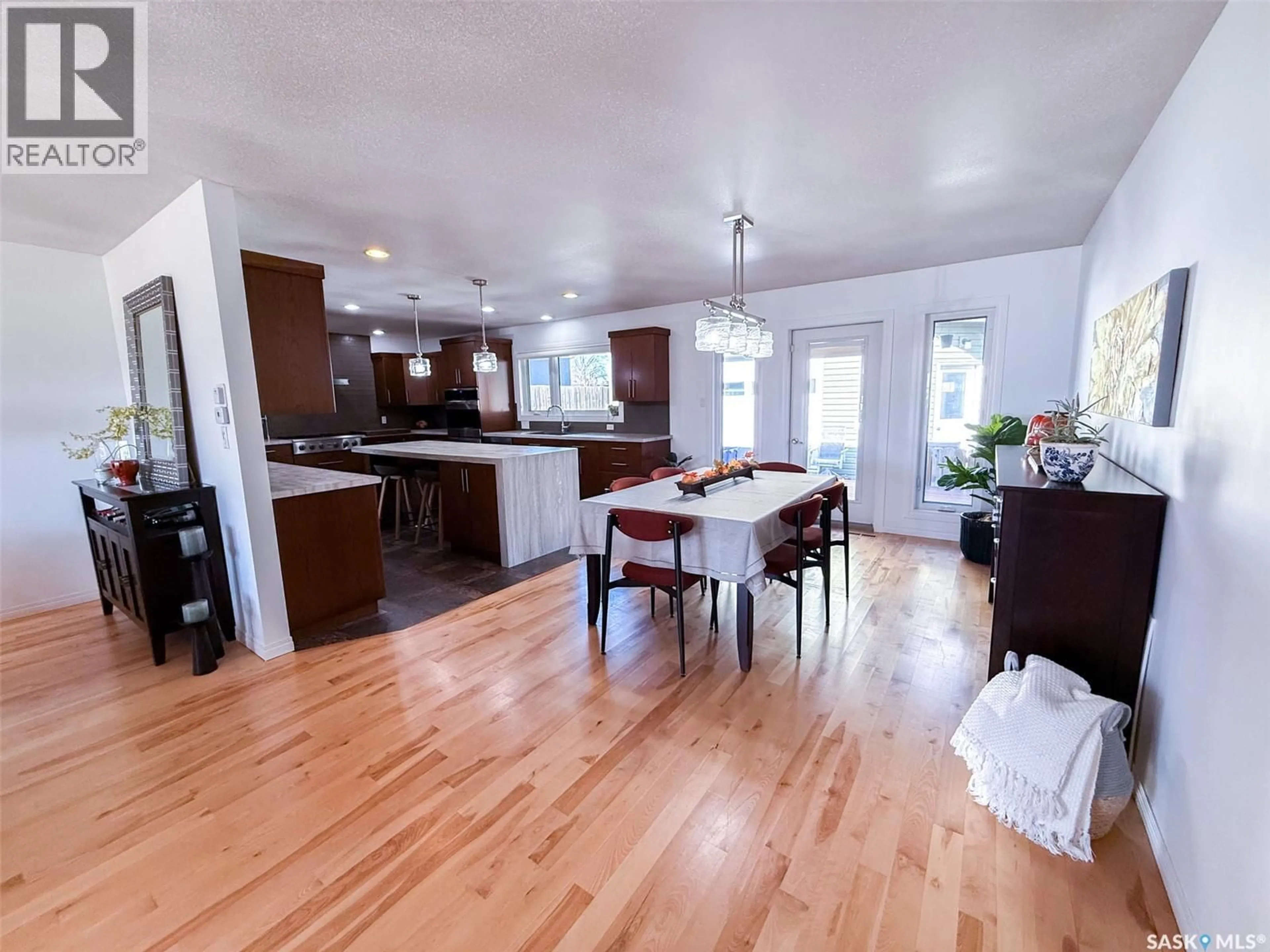 Open concept kitchen, wood/laminate floor for 1105 RIVERVIEW CRESCENT, Swift Current Saskatchewan S9H1Y8