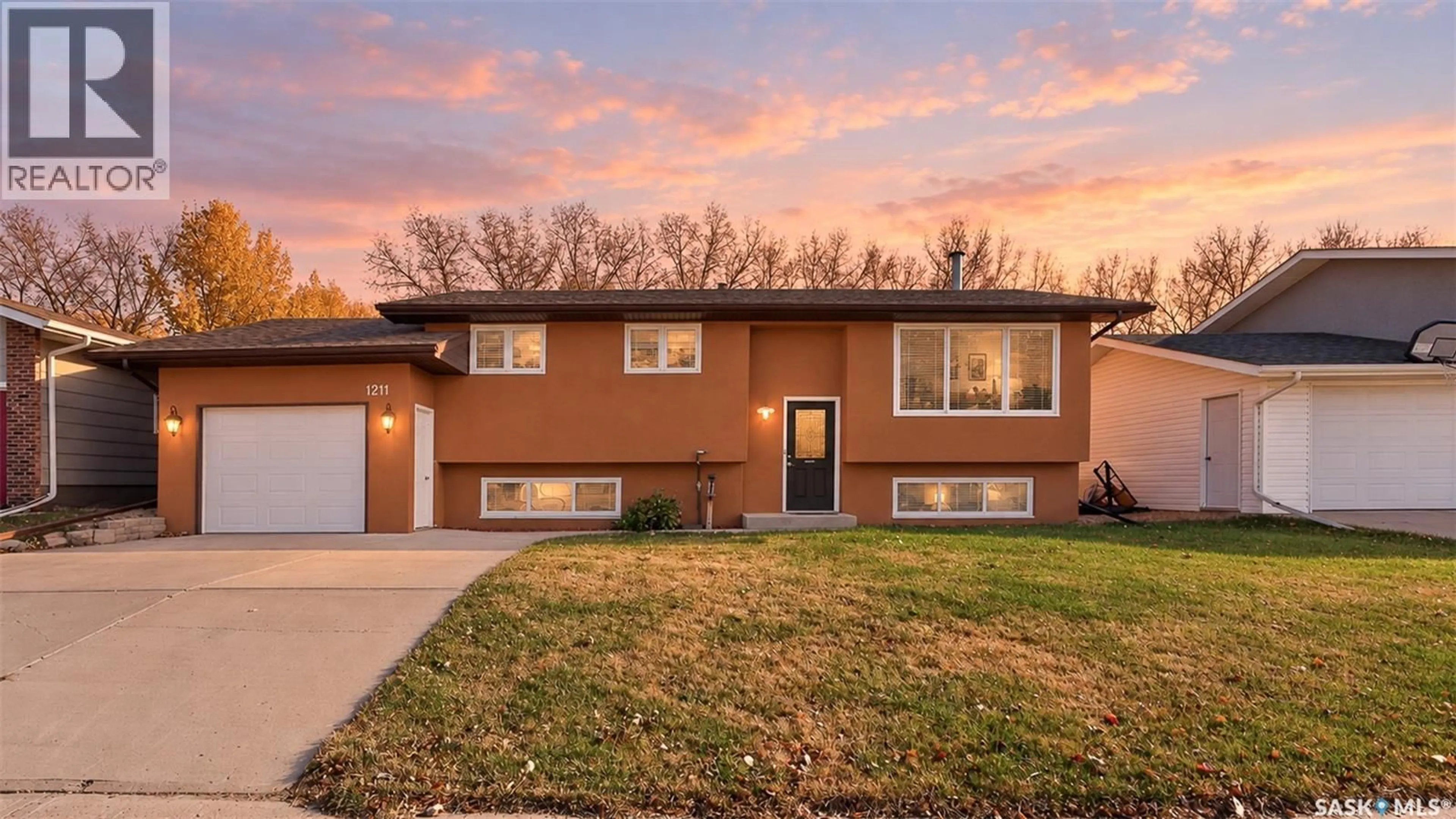 Home with brick exterior material, street for 1211 PASCOE DRIVE, Moose Jaw Saskatchewan S6H7A2