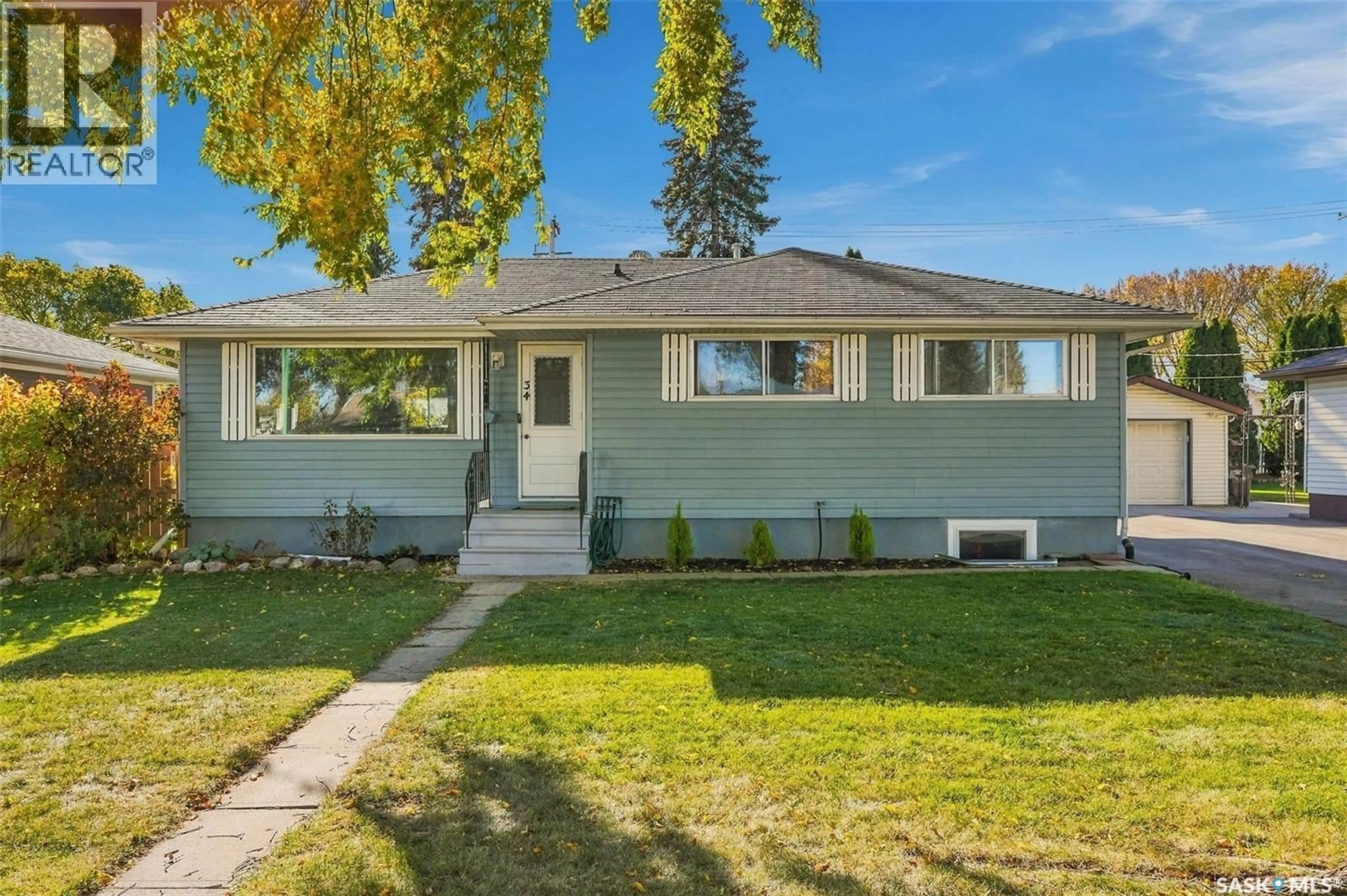 Home with vinyl exterior material, street for 34 MCASKILL CRESCENT, Saskatoon Saskatchewan S7J2P5