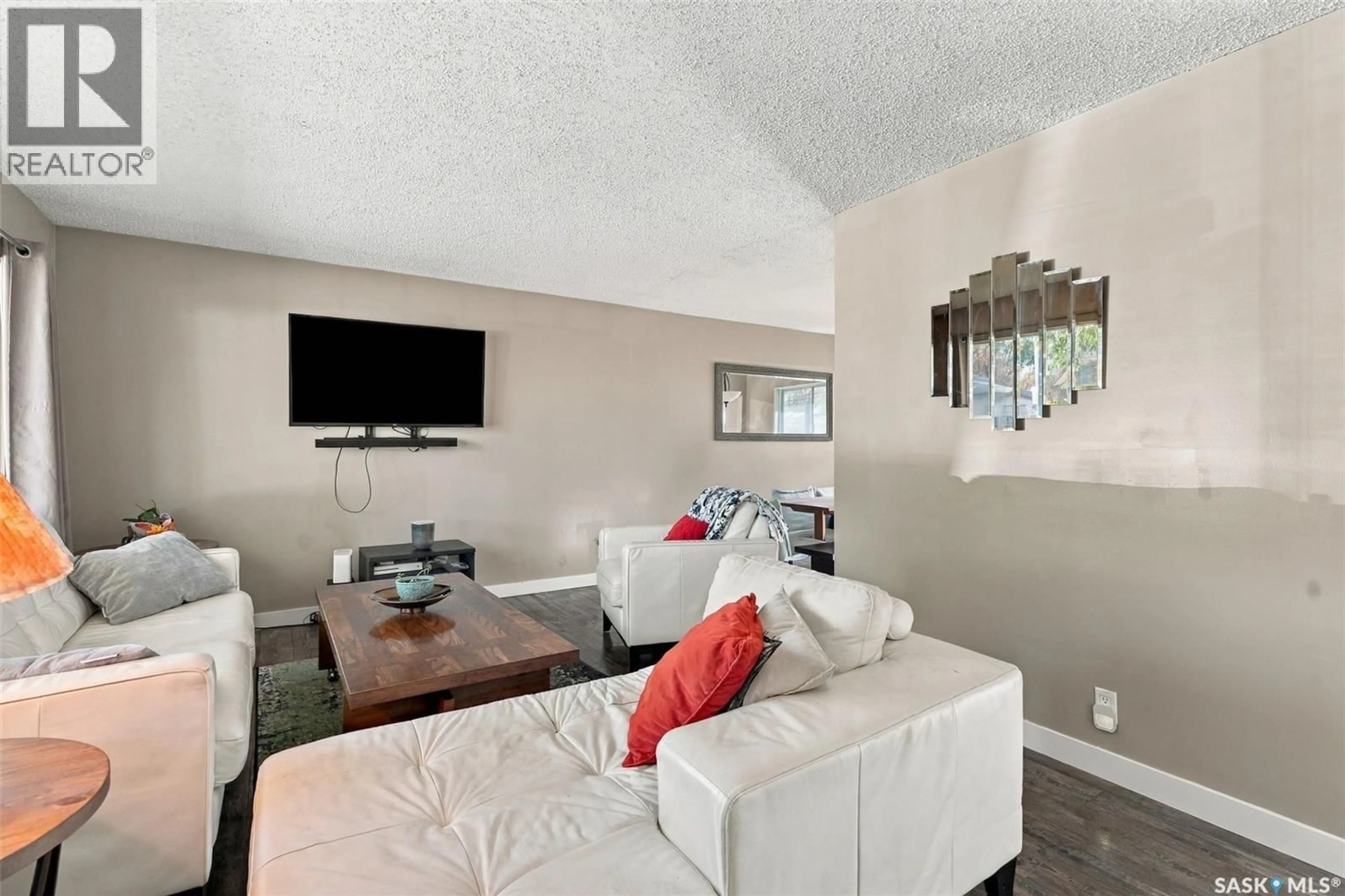 Living room with furniture, unknown for 34 MCASKILL CRESCENT, Saskatoon Saskatchewan S7J2P5