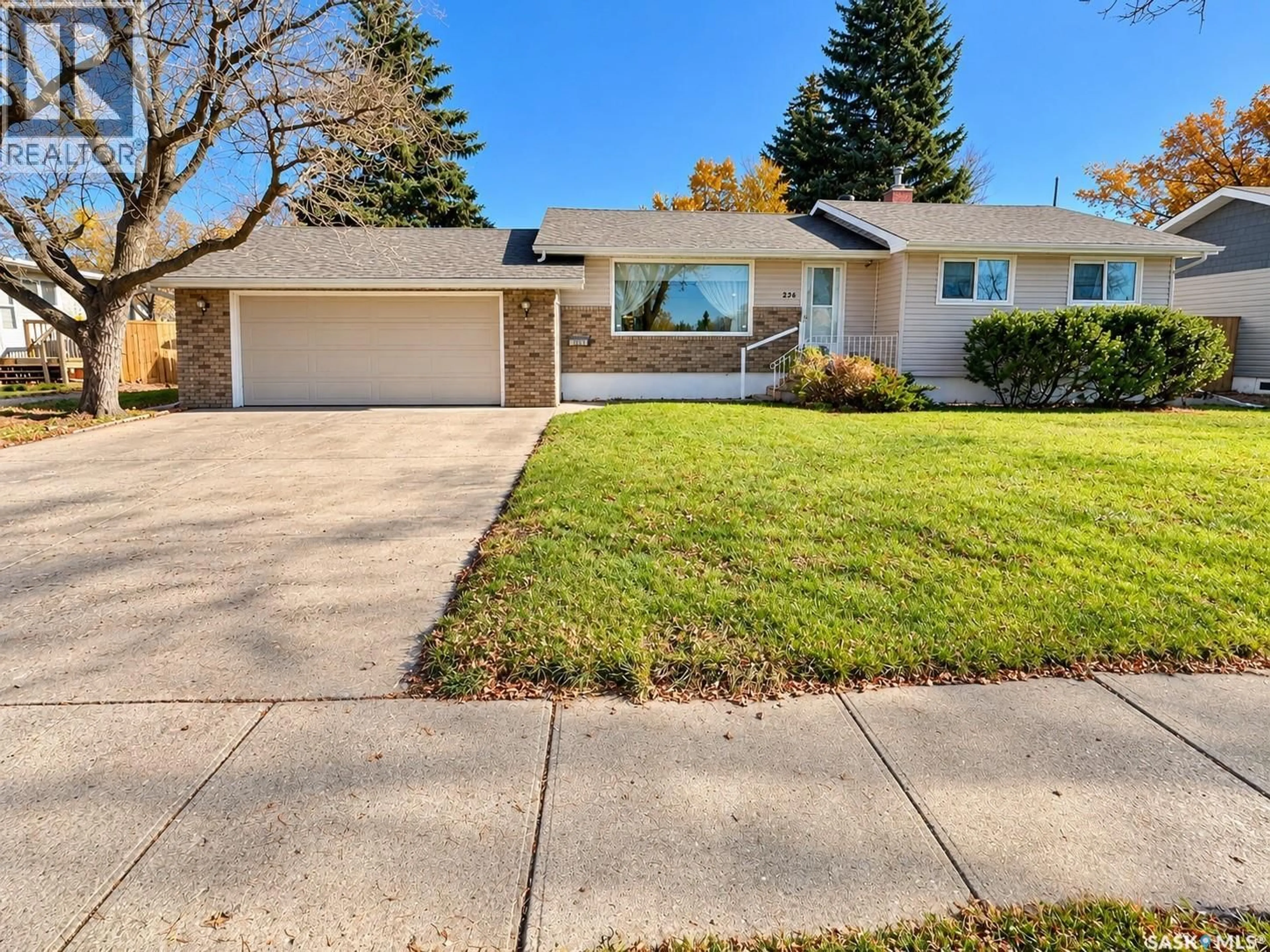 Home with vinyl exterior material, street for 236 13TH STREET, Weyburn Saskatchewan S4H1L2