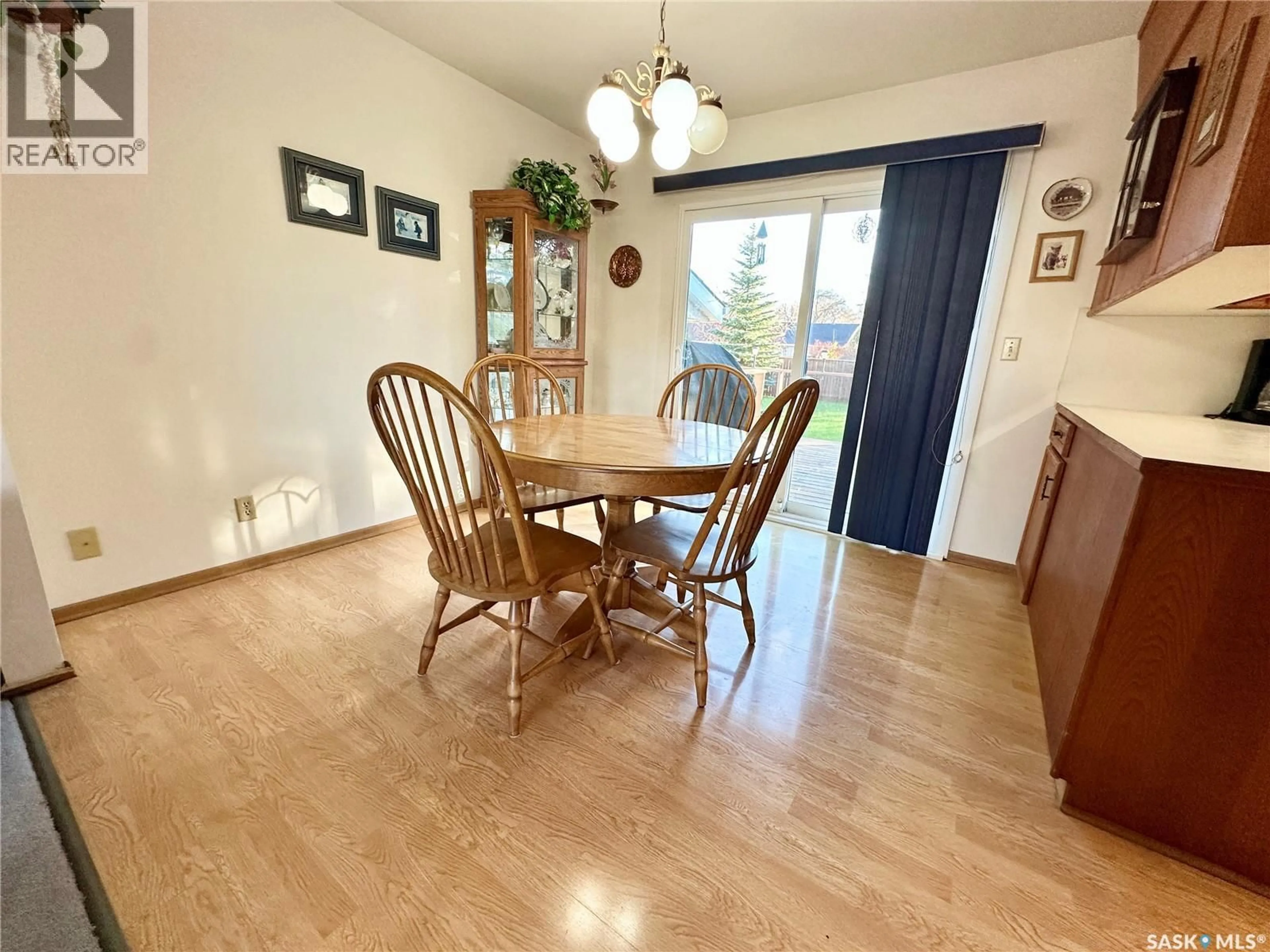 Dining room, wood/laminate floor for 236 13TH STREET, Weyburn Saskatchewan S4H1L2