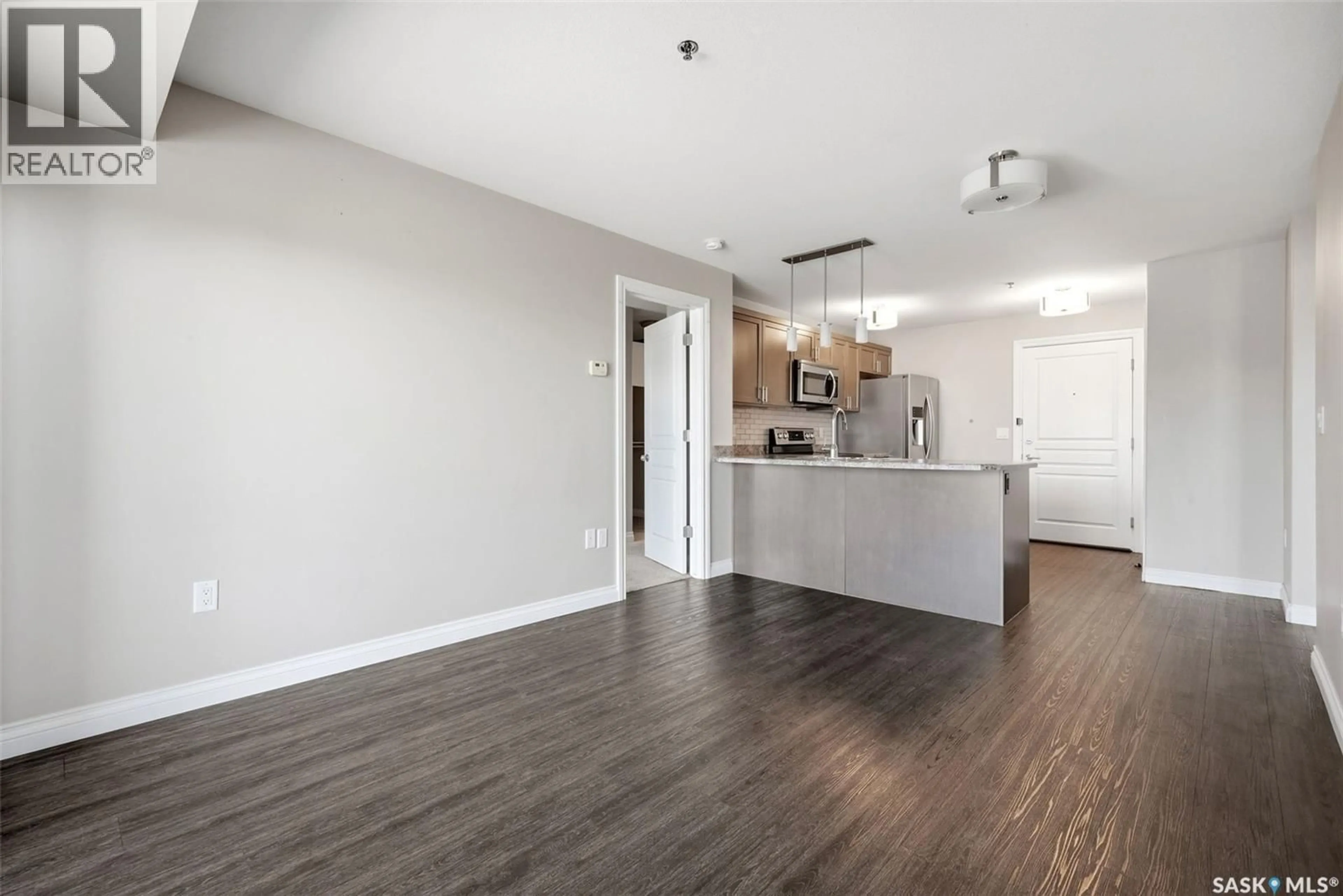 Open concept kitchen, wood/laminate floor for 216 - 3630 HAUGHTON ROAD, Regina Saskatchewan S4V1P1