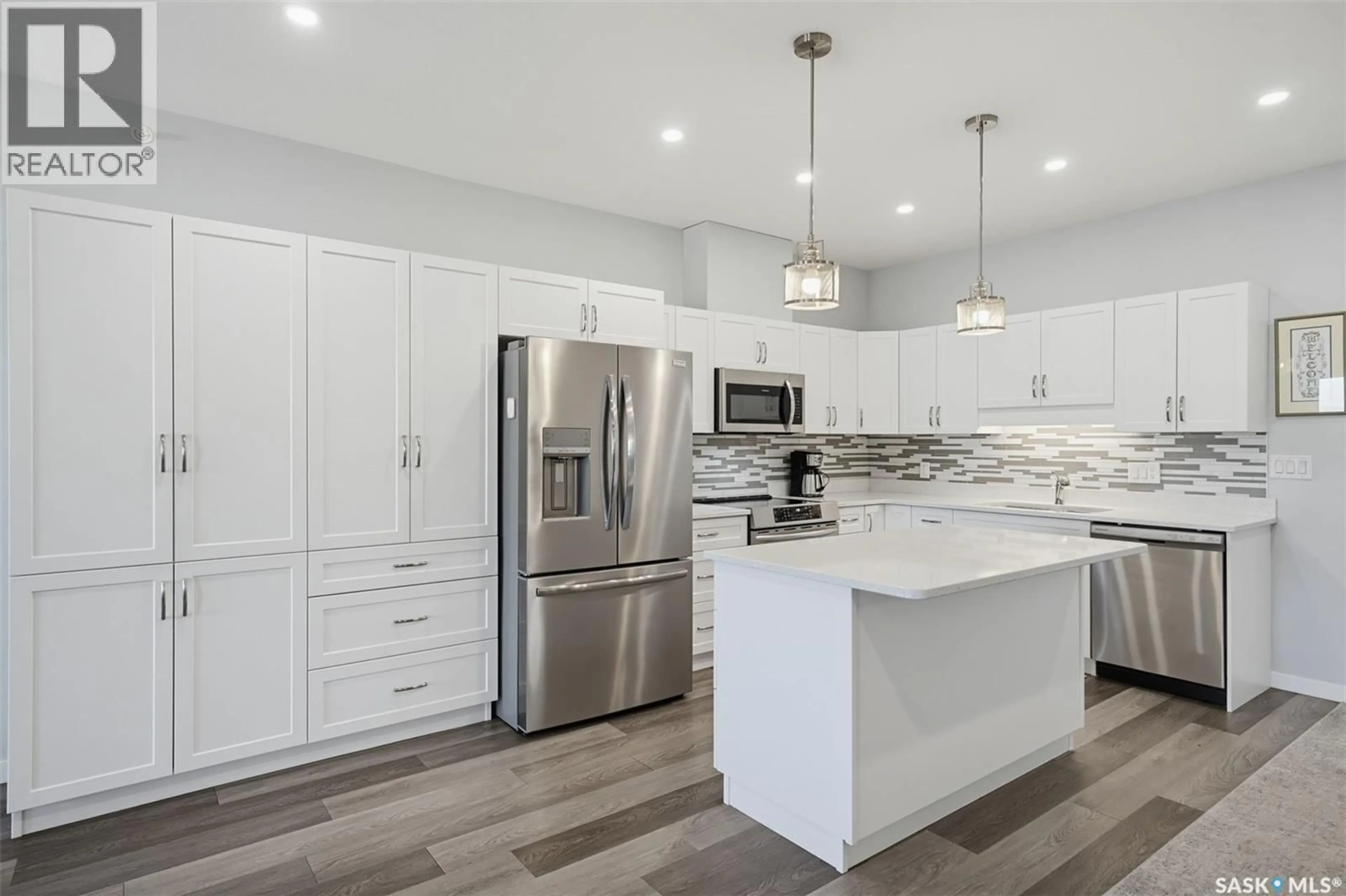 Open concept kitchen, ceramic/tile floor for 131 - 406 BEAUDRY CRESCENT, Martensville Saskatchewan S0K2T1