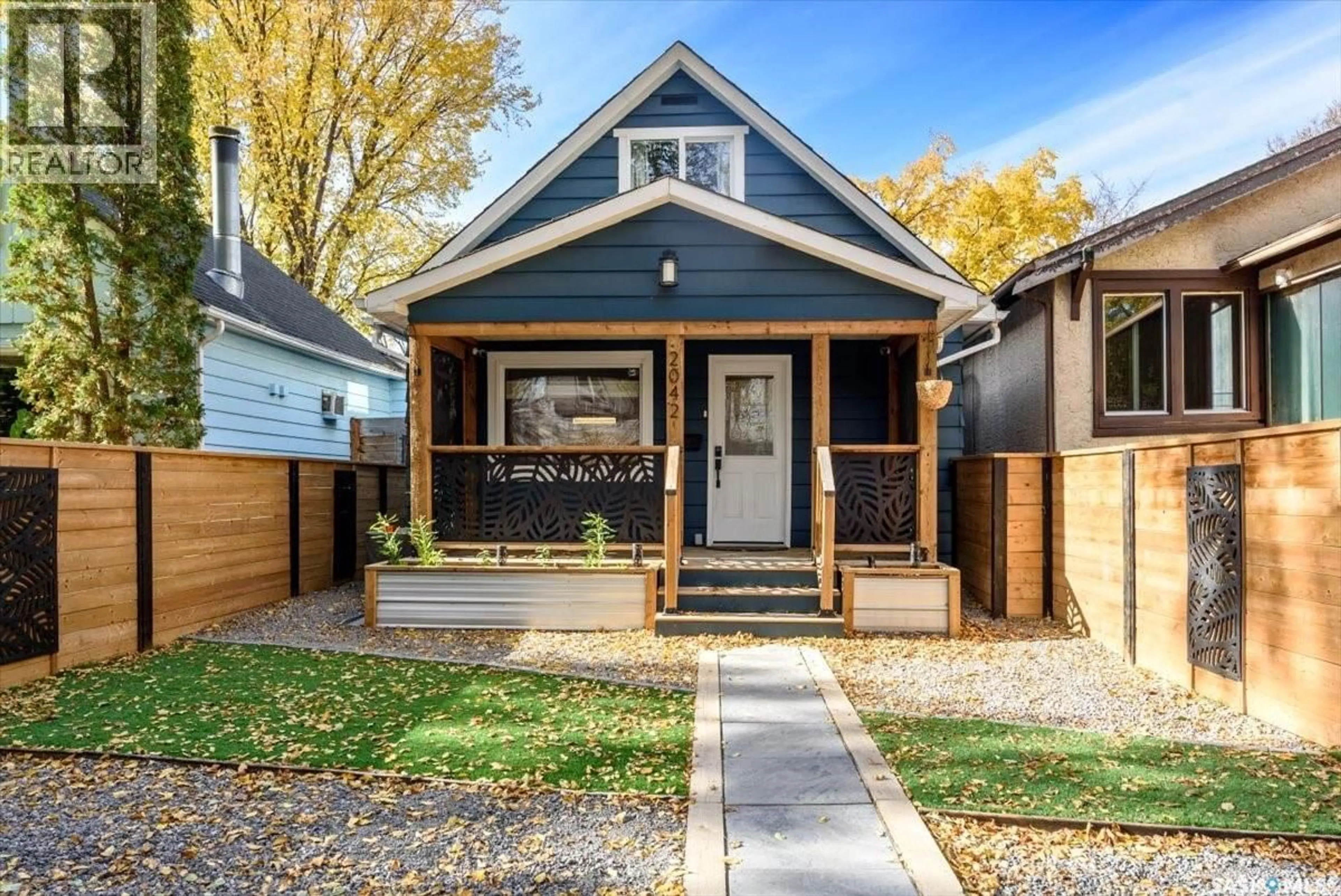 Home with vinyl exterior material, street for 2042 ARGYLE STREET, Regina Saskatchewan S4T3S7