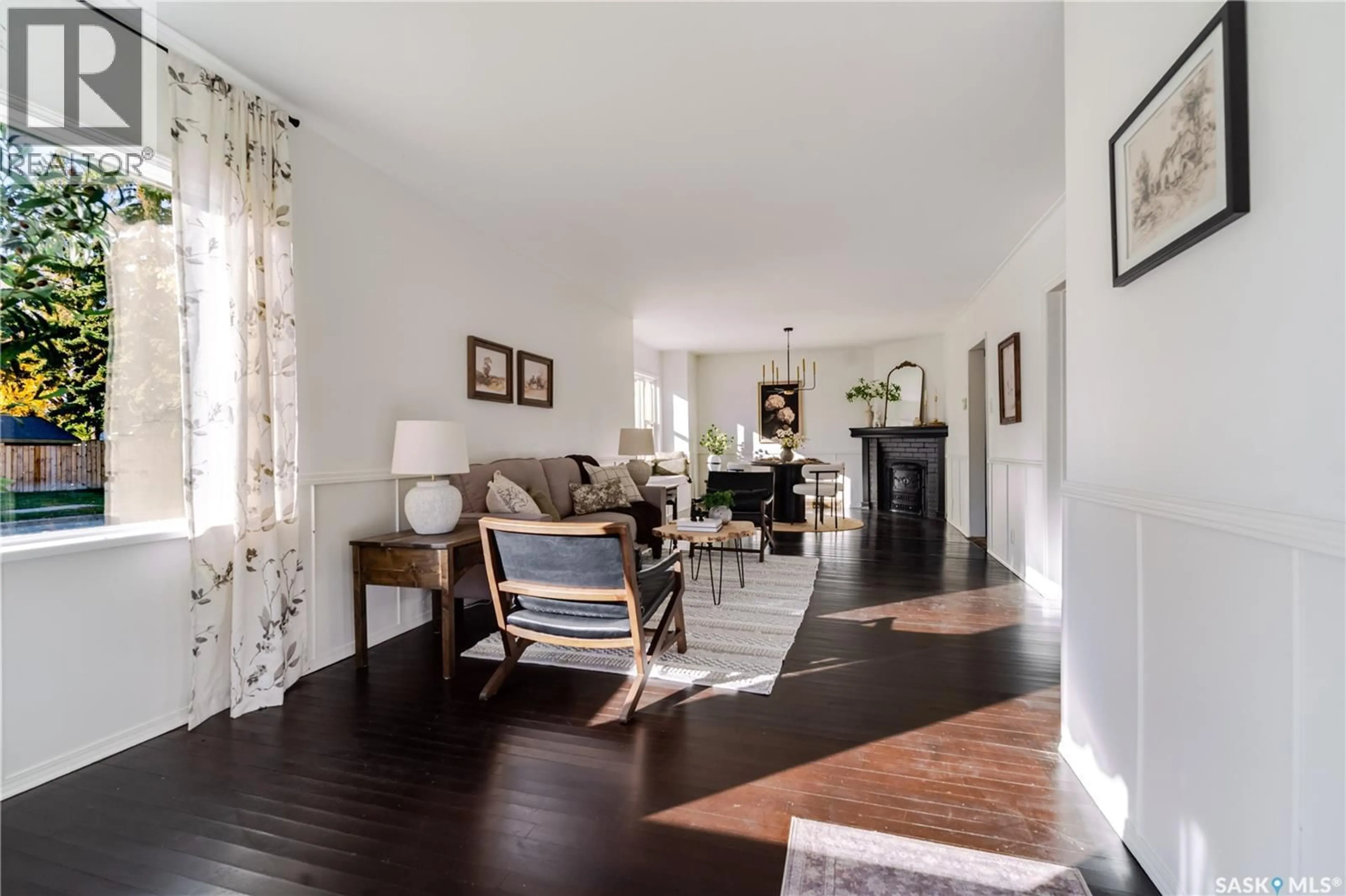 Living room with furniture, wood/laminate floor for 1302 1ST AVENUE, Moose Jaw Saskatchewan S6H3N7