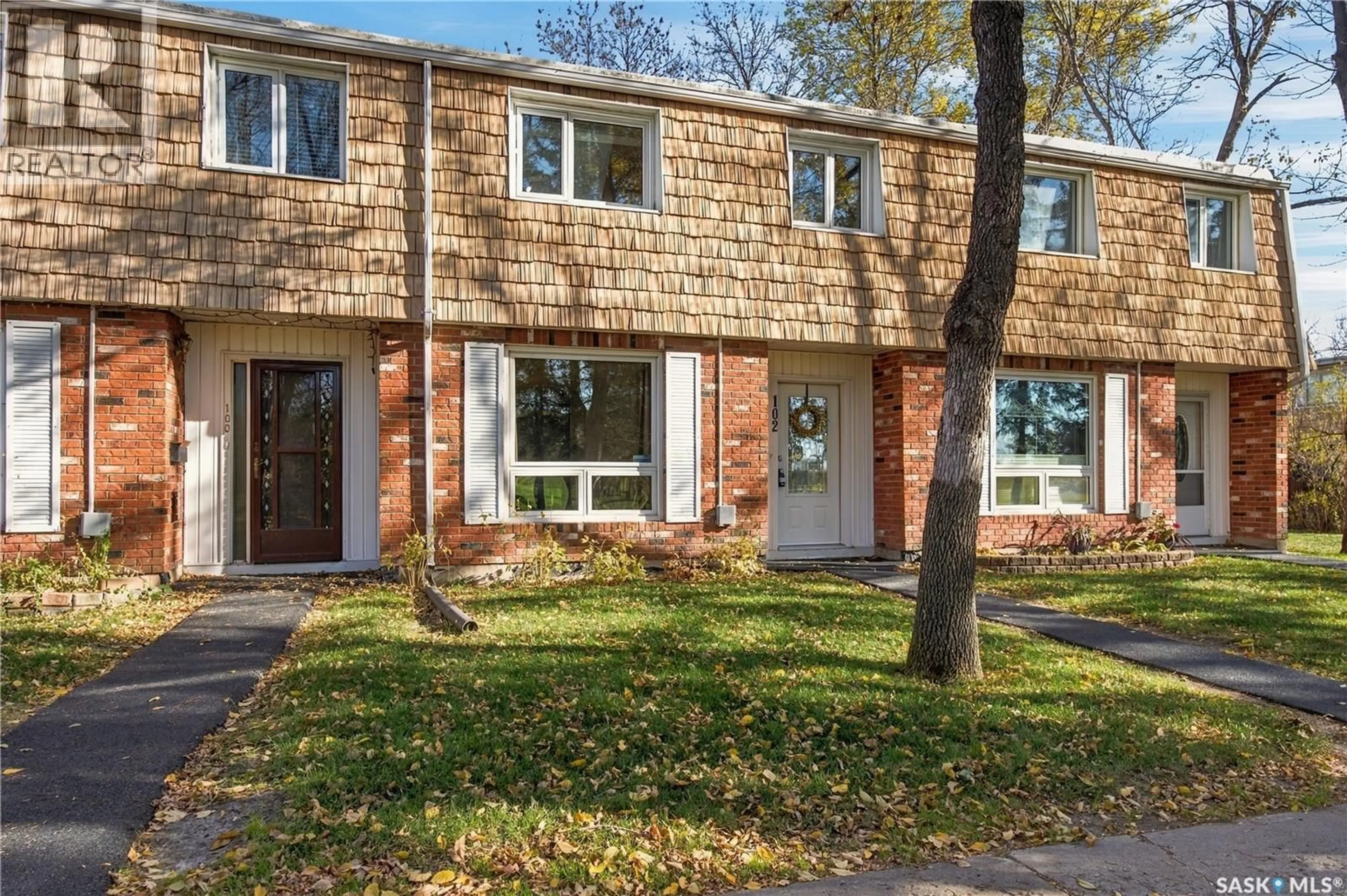 Home with brick exterior material, street for 102 OAKVIEW DRIVE, Regina Saskatchewan S4R0E4