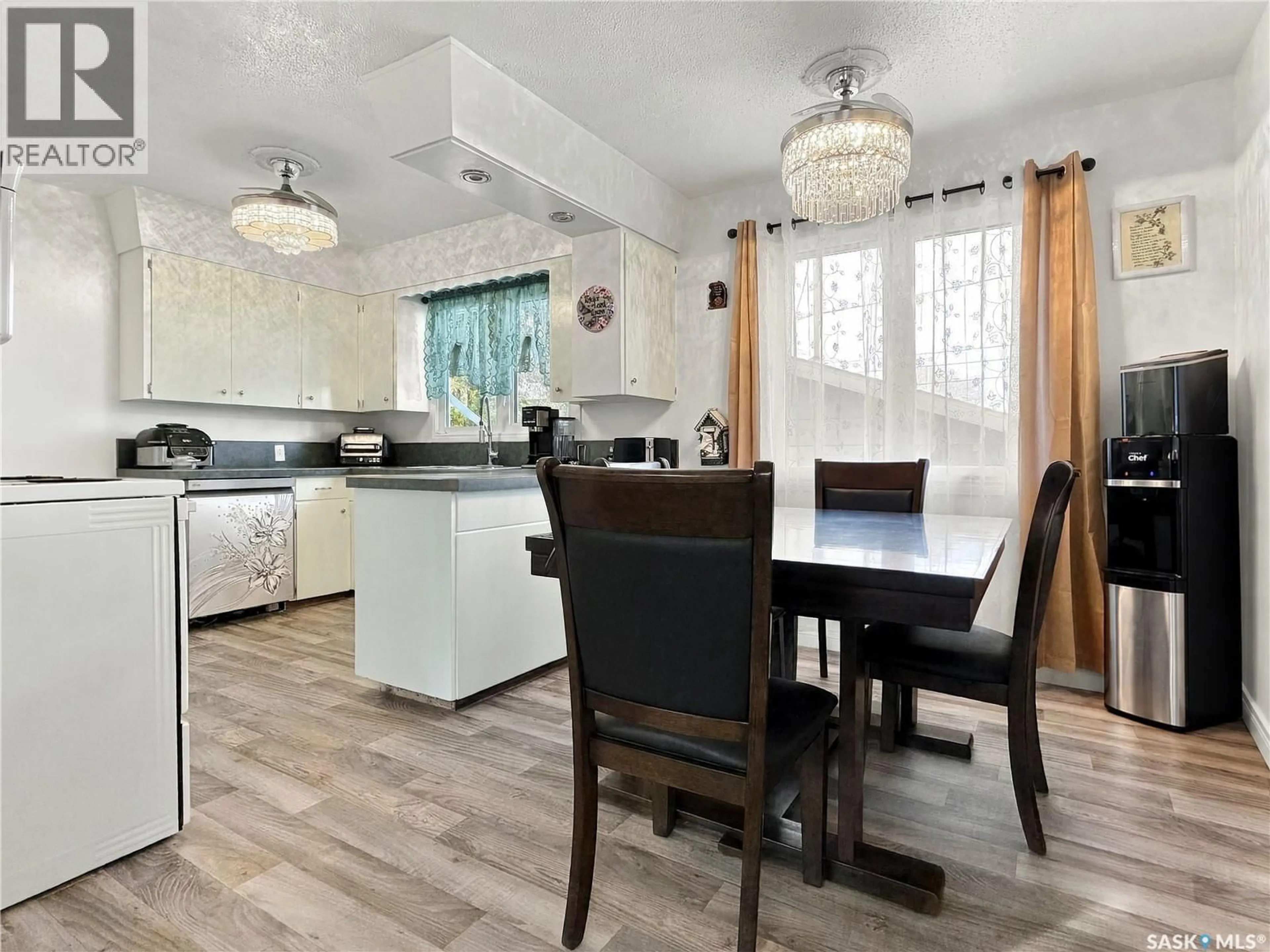 Open concept kitchen, wood/laminate floor for 121 ALLEN DRIVE, Swift Current Saskatchewan S9H3A2